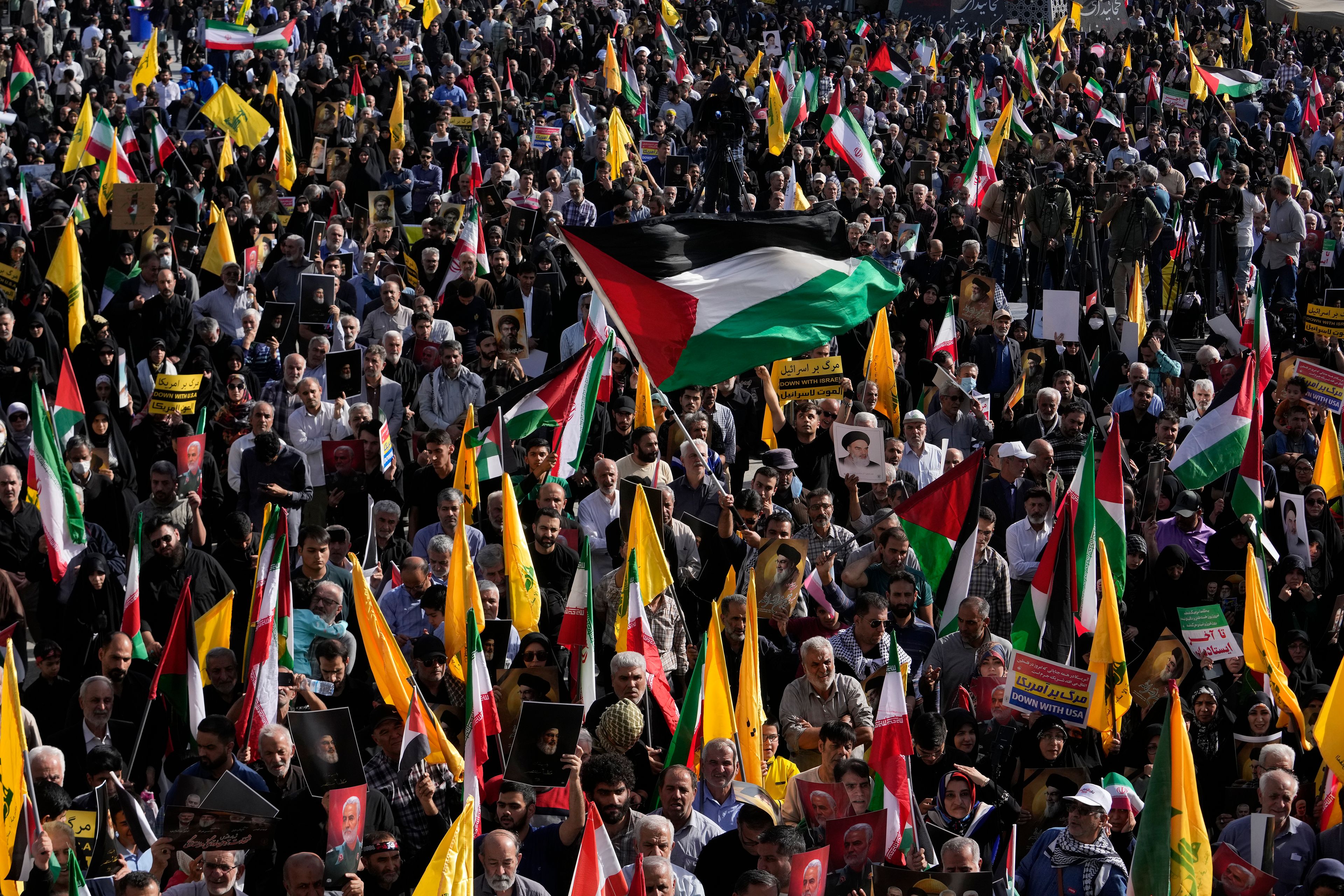 A demonstrator waves a Palestinian flag at a rally commemorating slain Hezbollah leader Hassan Nasrallah, in Tehran, Iran, Wednesday, Oct. 2, 2024. (AP Photo/Vahid Salemi)