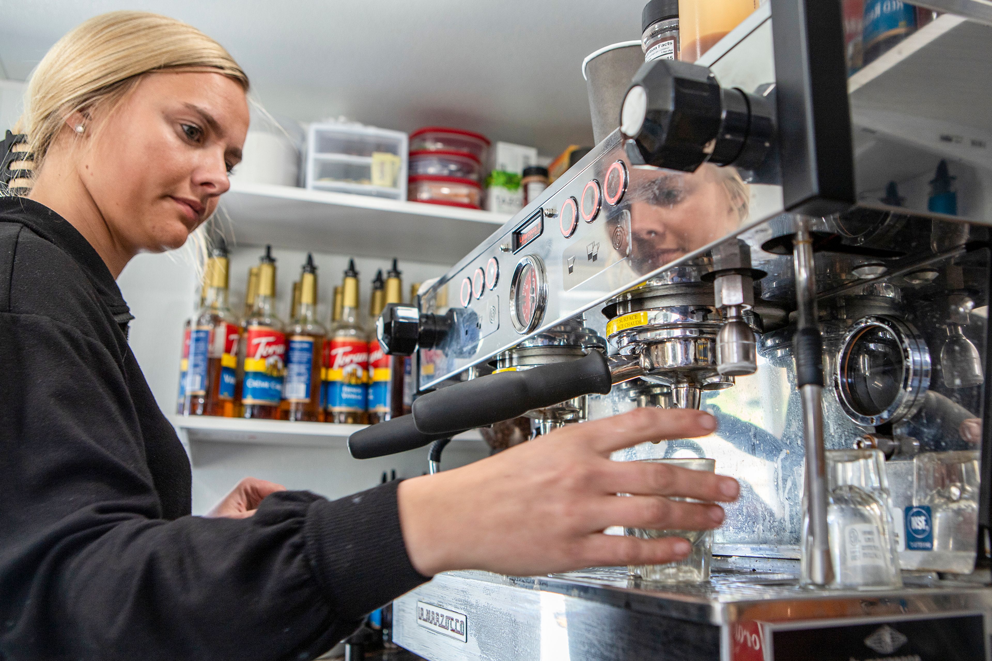 Shania Hildreth, of Lewiston, prepares an espresso beverage Wednesday in her coffee cart, Backwoods Brew, at the Food Yard at the corner of 11th and Snake River avenues in Lewiston.