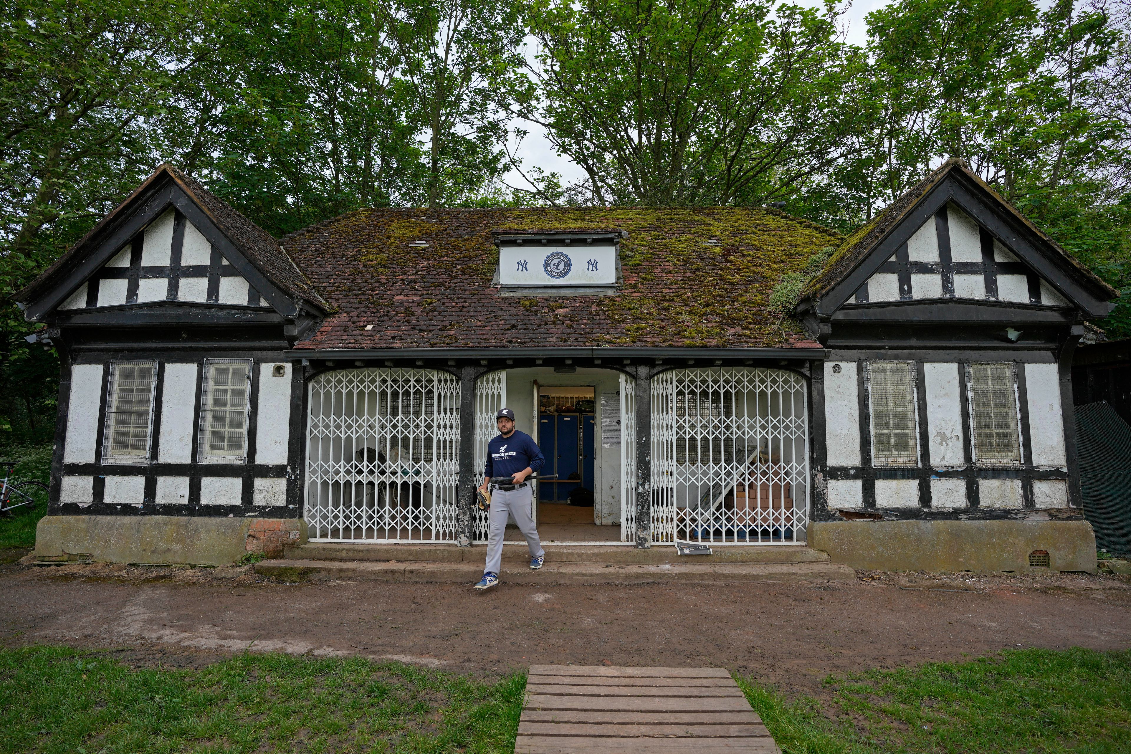 A player of the UK baseball team London Mets arrives clubhouse for a training session at the Finsbury Park in London, Thursday, May 16, 2024. Baseball at the highest club level in Britain is competitive. Teams are mélange of locals and expats some with college and minor league experience.