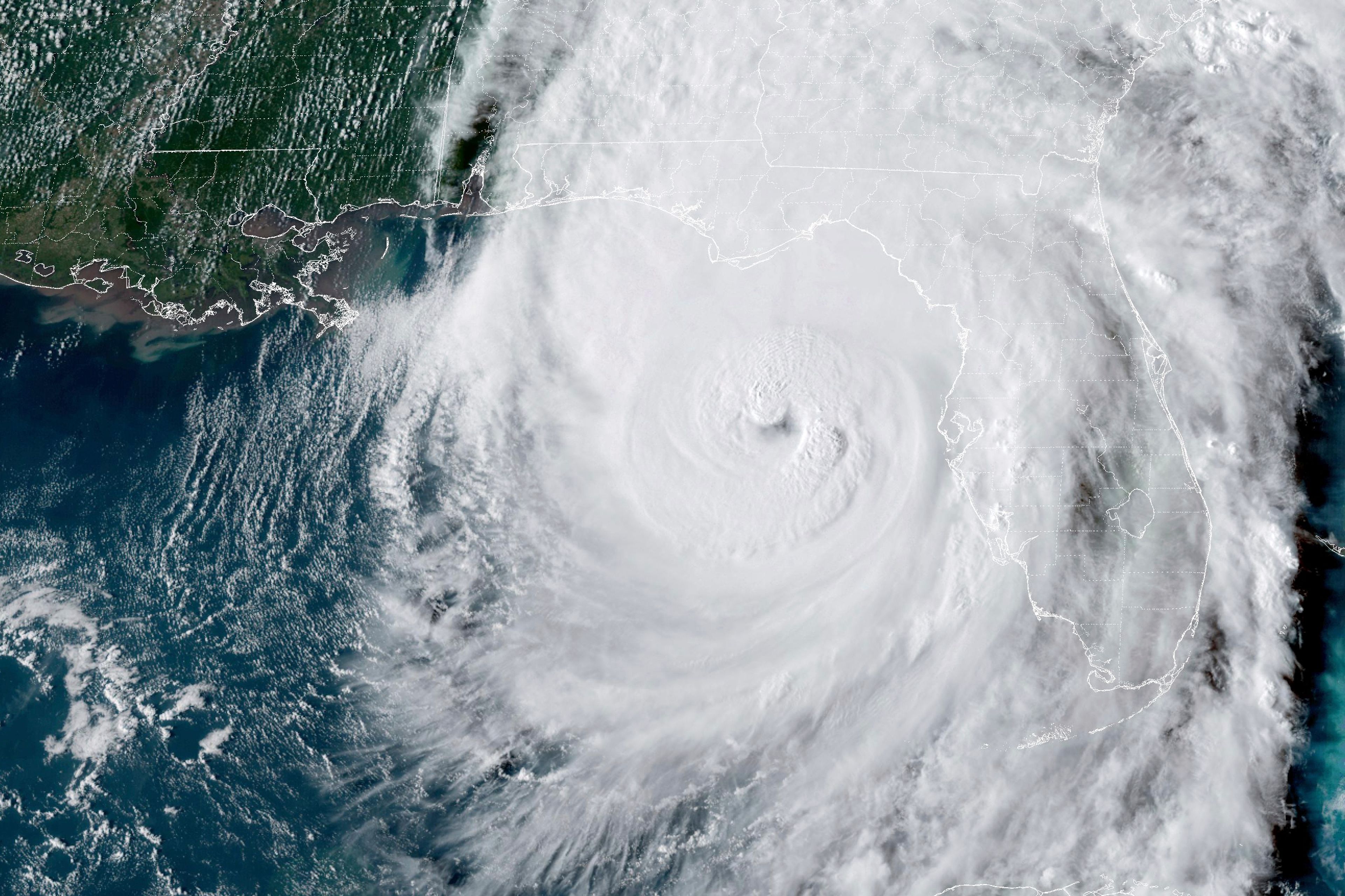 This GOES-16 GeoColor satellite image taken at 5:46 p.m. EDT and provided by National Oceanic and Atmospheric Administration (NOAA) shows Hurricane Helene in the Gulf of Mexico moving towards Florida, Thursday, Sept. 26 2024. (NOAA via AP)