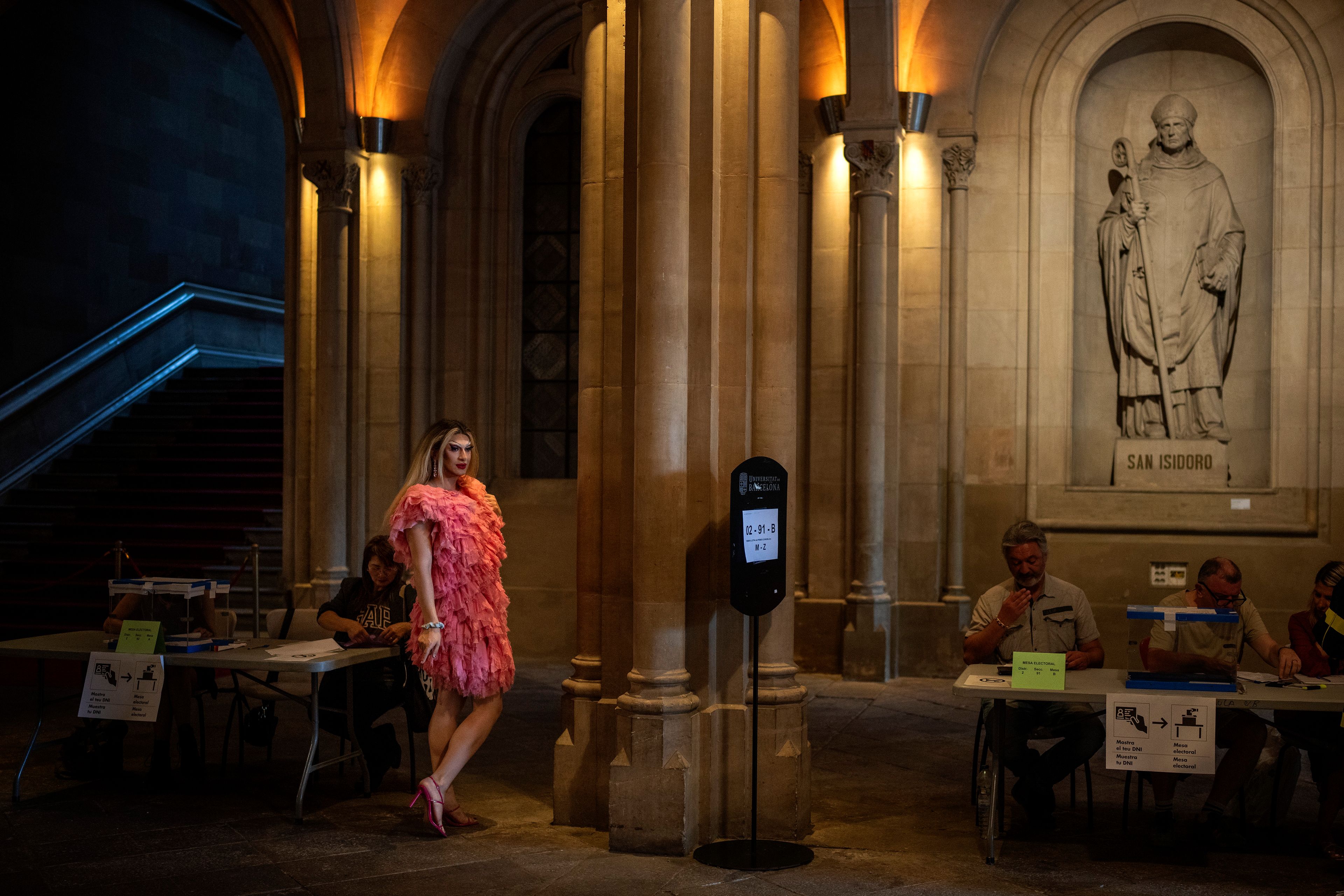 Drag queen Bernat Bodes, known as Pitita, left, takes a break from her duties as president of a polling station during the European Parliament elections in Barcelona, Spain, Sunday, June 9, 2024. Polling stations have opened across Europe as voters from 20 countries cast ballots in elections that are expected to shift the European Union’s parliament to the right and could reshape the future direction of the world’s biggest trading bloc.