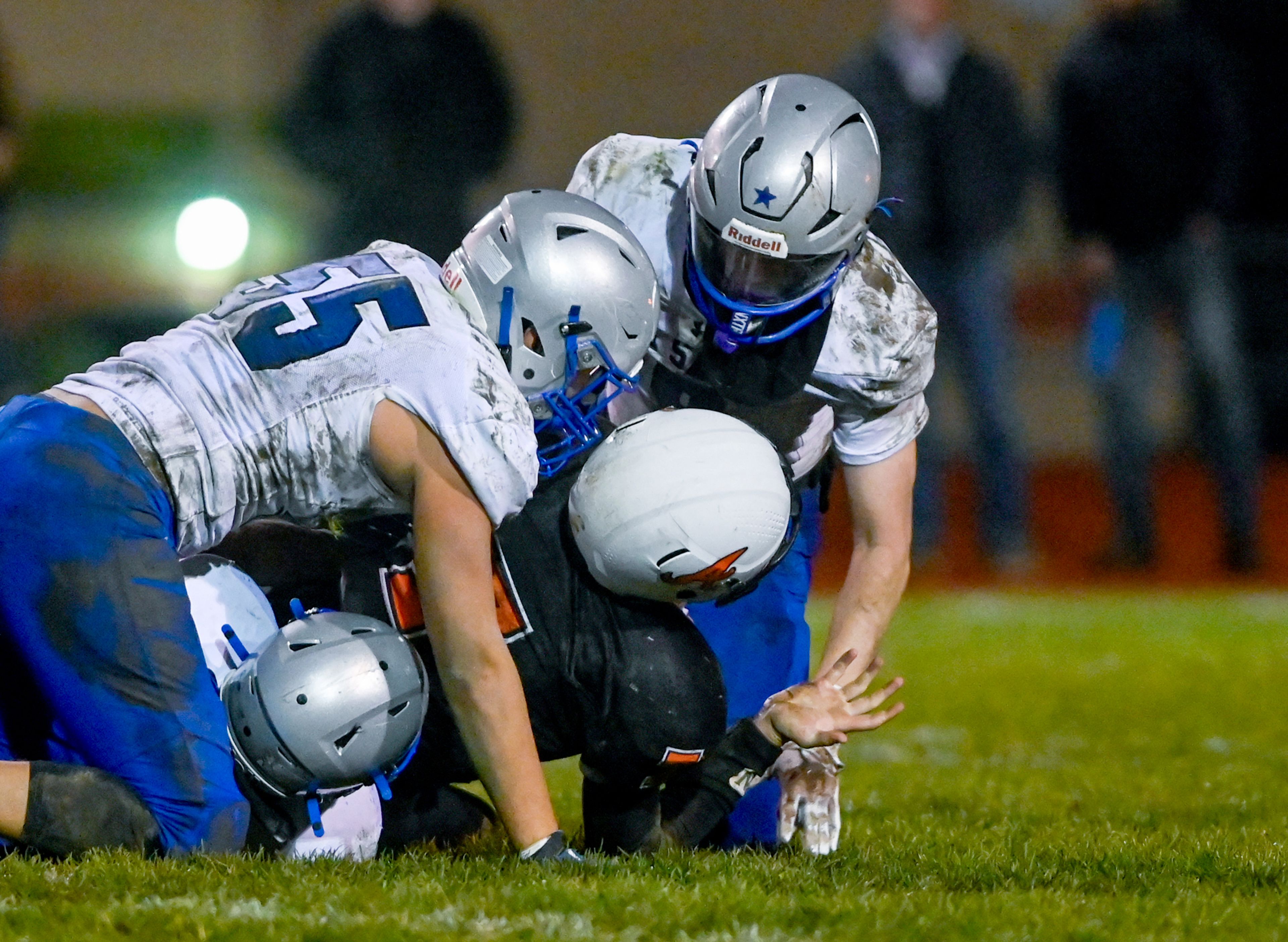 Asotin’s Cody Ells is pulled to the ground by La Salle defenders Saturday during a Washington 2B state tournament game in Clarkston.