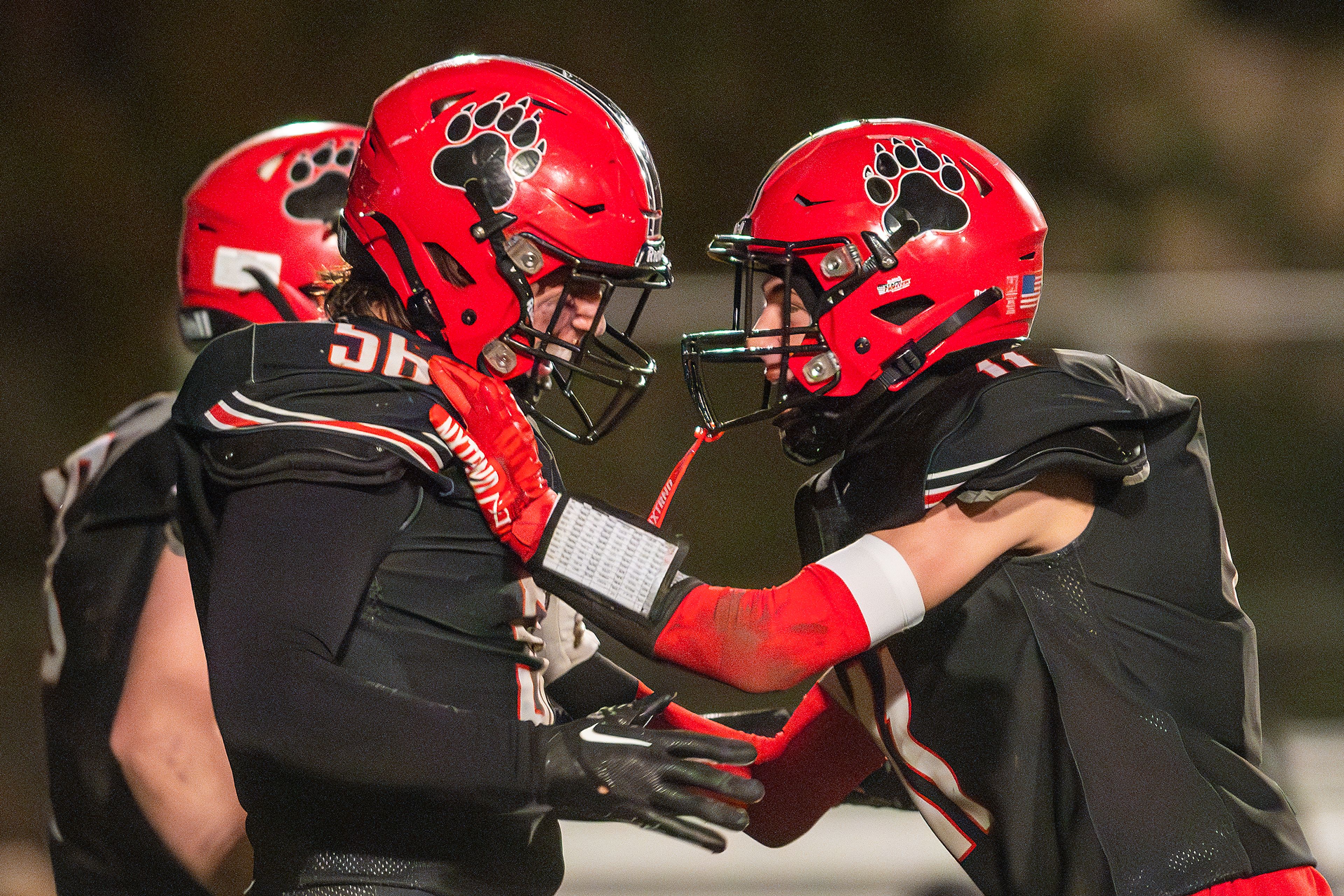 Moscow linebacker Finny Needham, left, reacts after getting a sack on the American Falls quarterback during an Idaho 4A state playoff game Friday in Moscow.