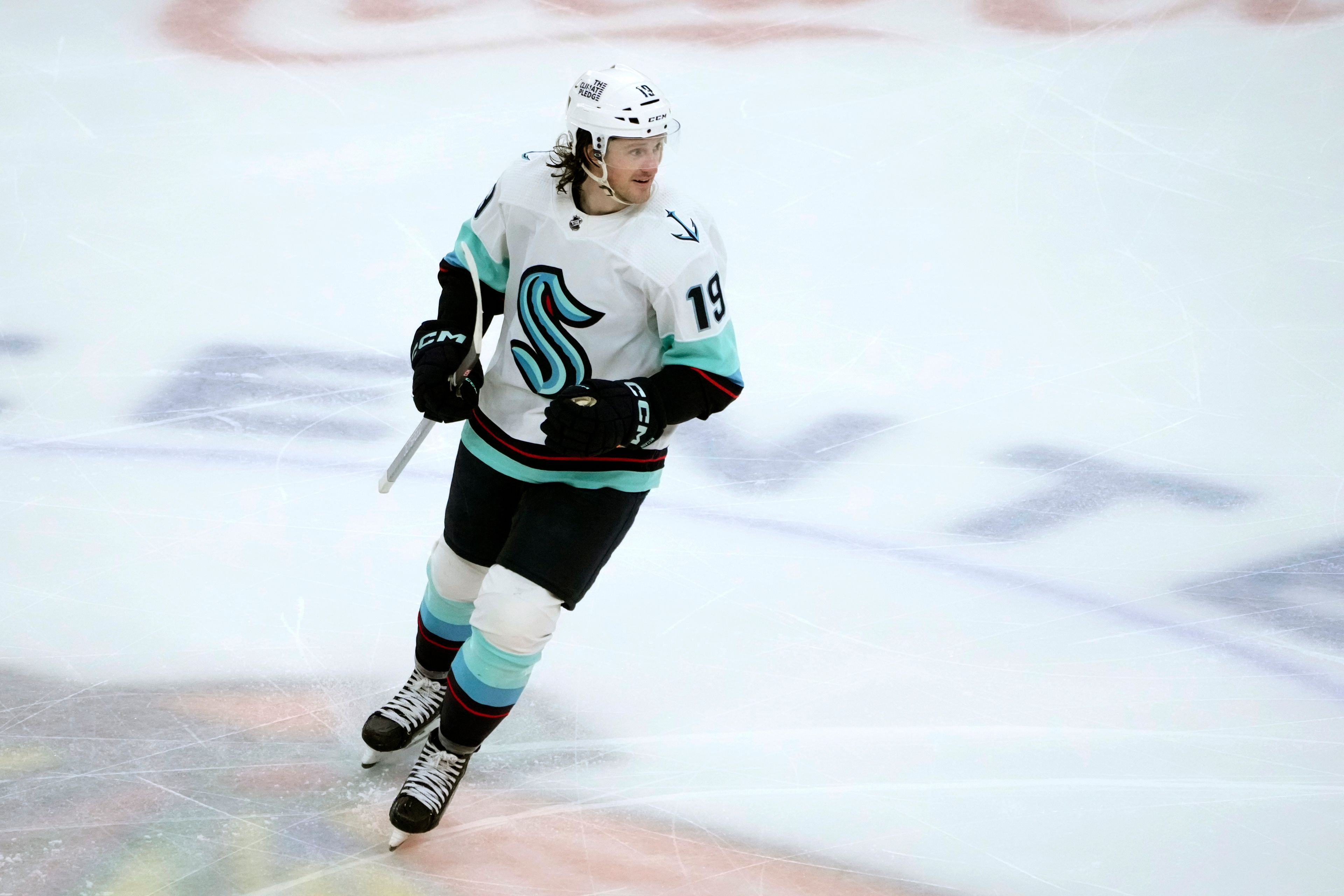 Seattle Kraken's Jared McCann smiles after recording a hat trick during the third period of the team's NHL hockey game against the Chicago Blackhawks on Saturday, Jan. 14, 2023, in Chicago. (AP Photo/Charles Rex Arbogast)