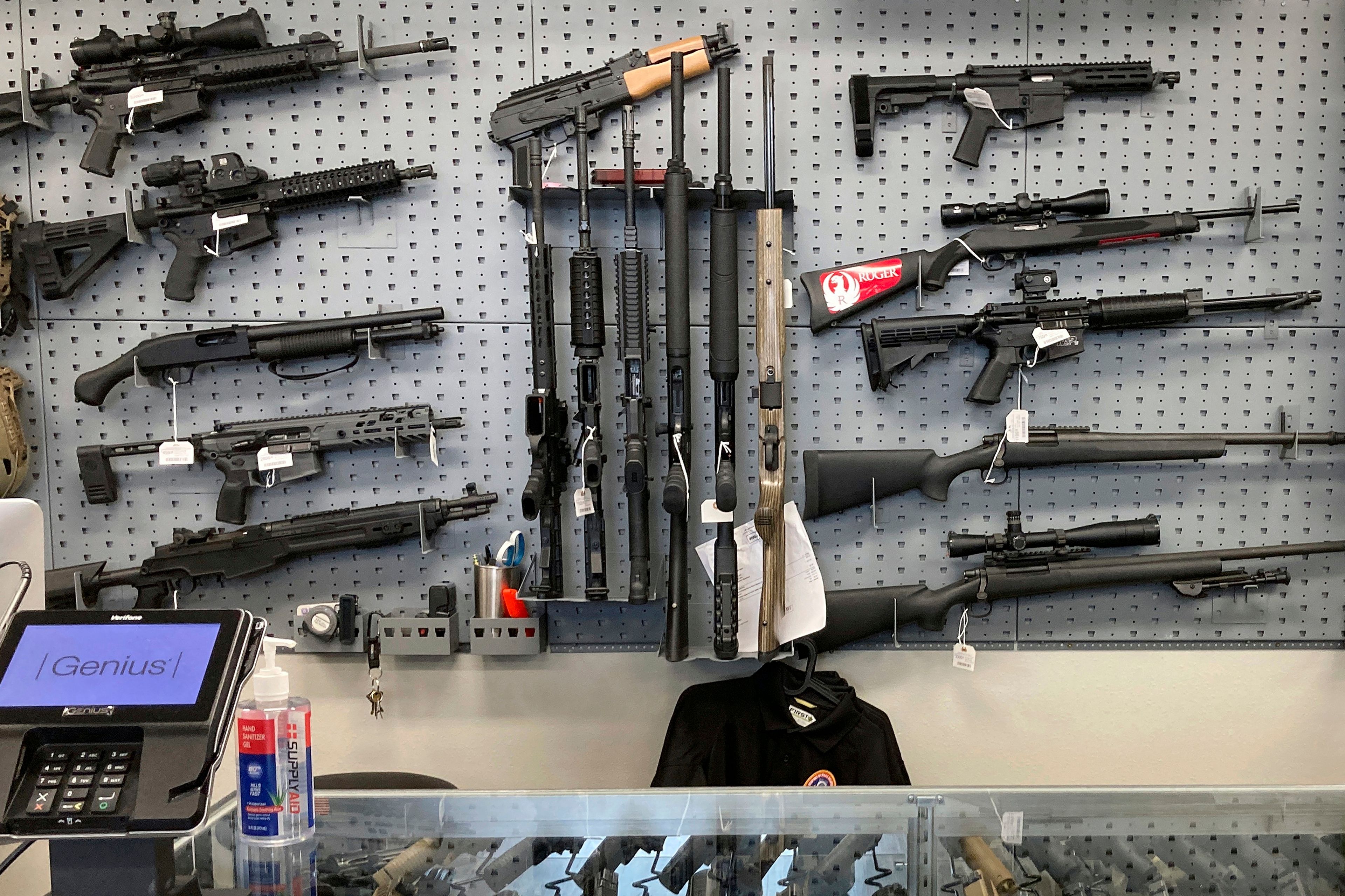 FILE - Firearms are displayed at a gun shop in Salem, Ore., on Feb. 19, 2021. Oregon lawmakers will take up a full slate of legislation on pressing and polarizing issues from homelessness to gun control to abortion access when the legislative session starts next week after mid-term elections that cost Democrats their supermajority but swept in a new, progressive governor. (AP Photo/Andrew Selsky, File)