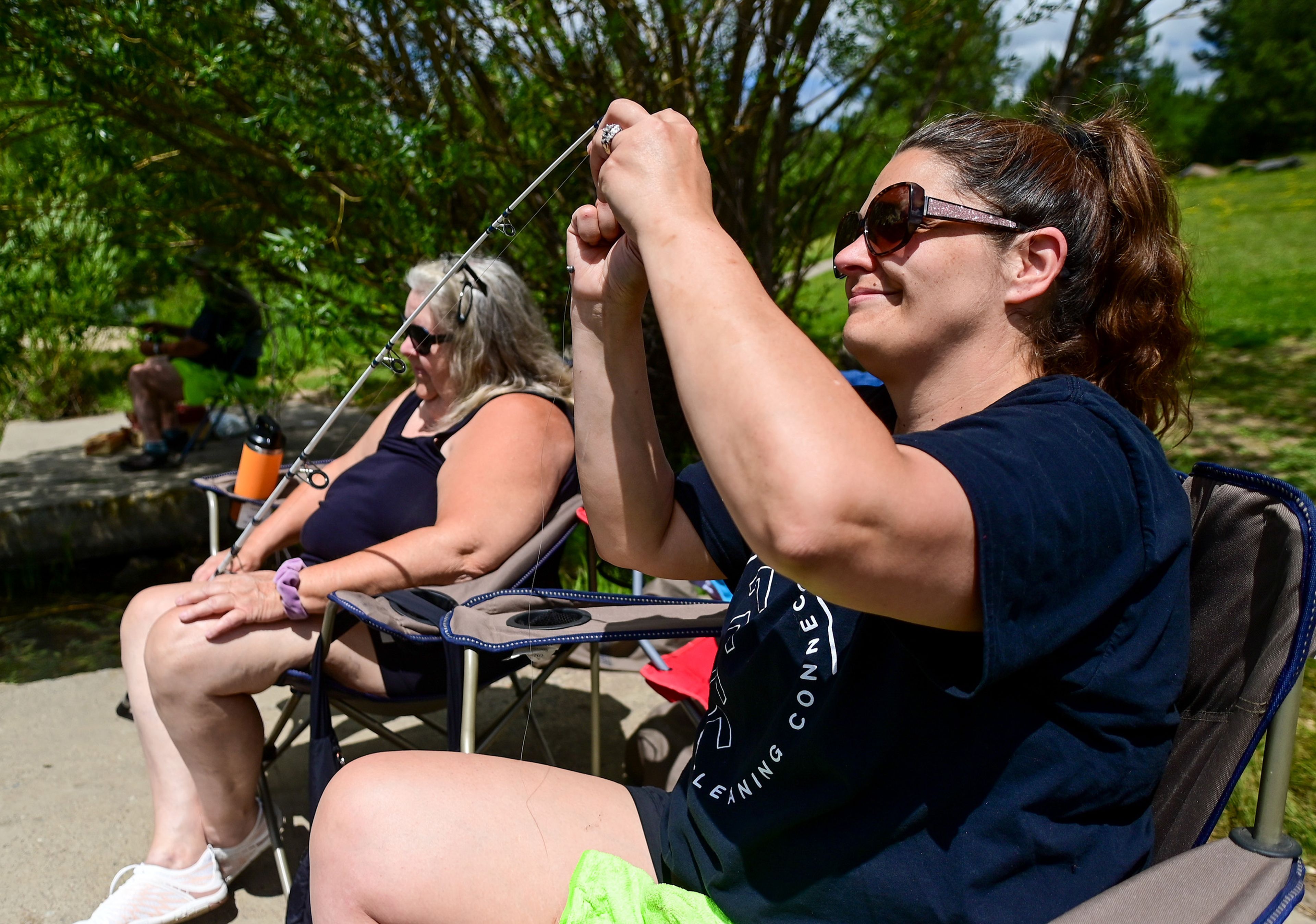 Michelle Foutch, right, of Moscow, prepares a hook for her mother Diana Arnett, of Kendrick, as the two fish at the Spring Valley Reservoir outside of Troy on Friday.