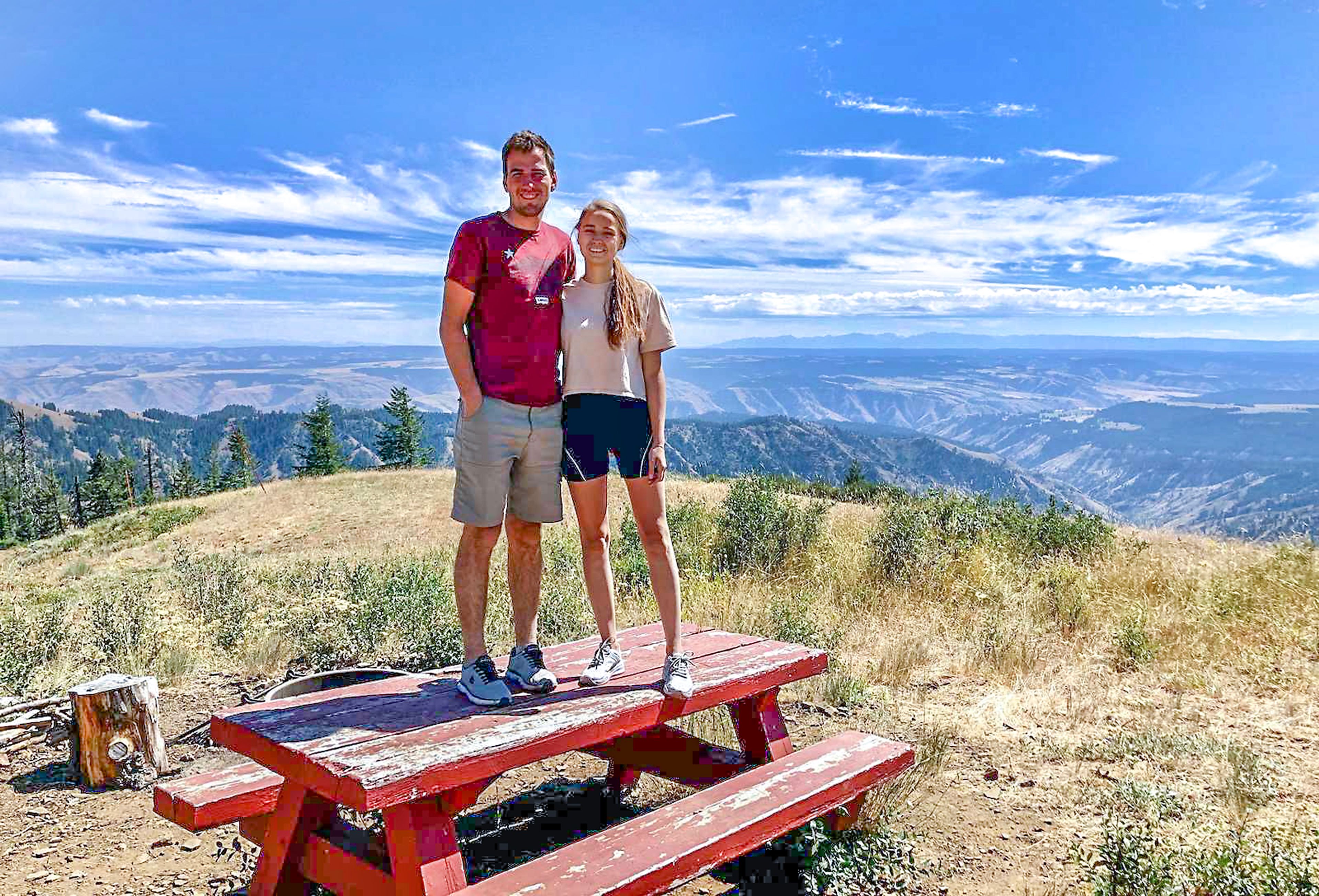 Anton and Ilona Kurhanova pose for a picture in the yard of Wenatchee Guard Station.