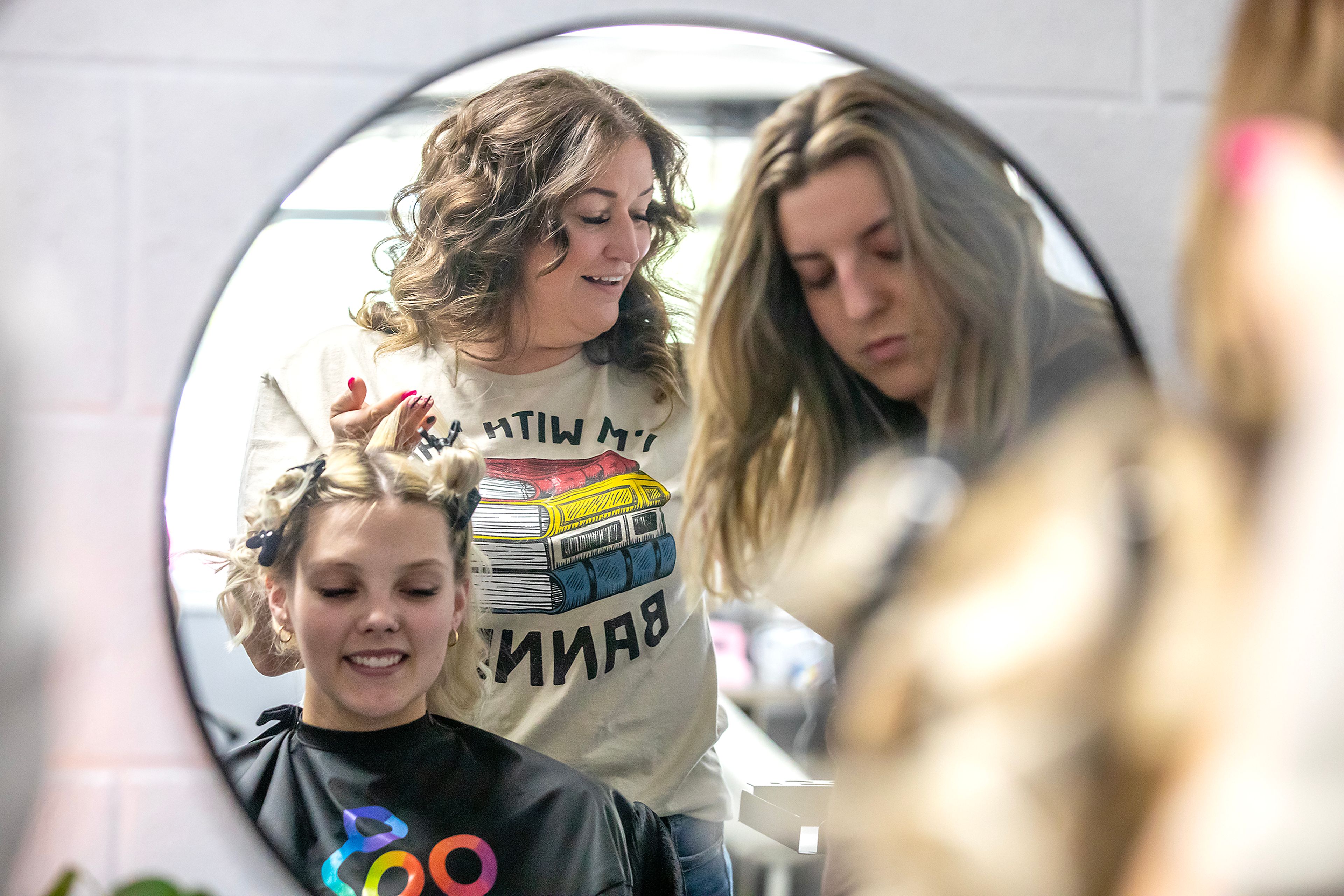 Anna Estrada demonstrates foiling for a photo on Halle Kincaid Wednesday at Style Bar Beauty Academy Wednesday in Lewiston.