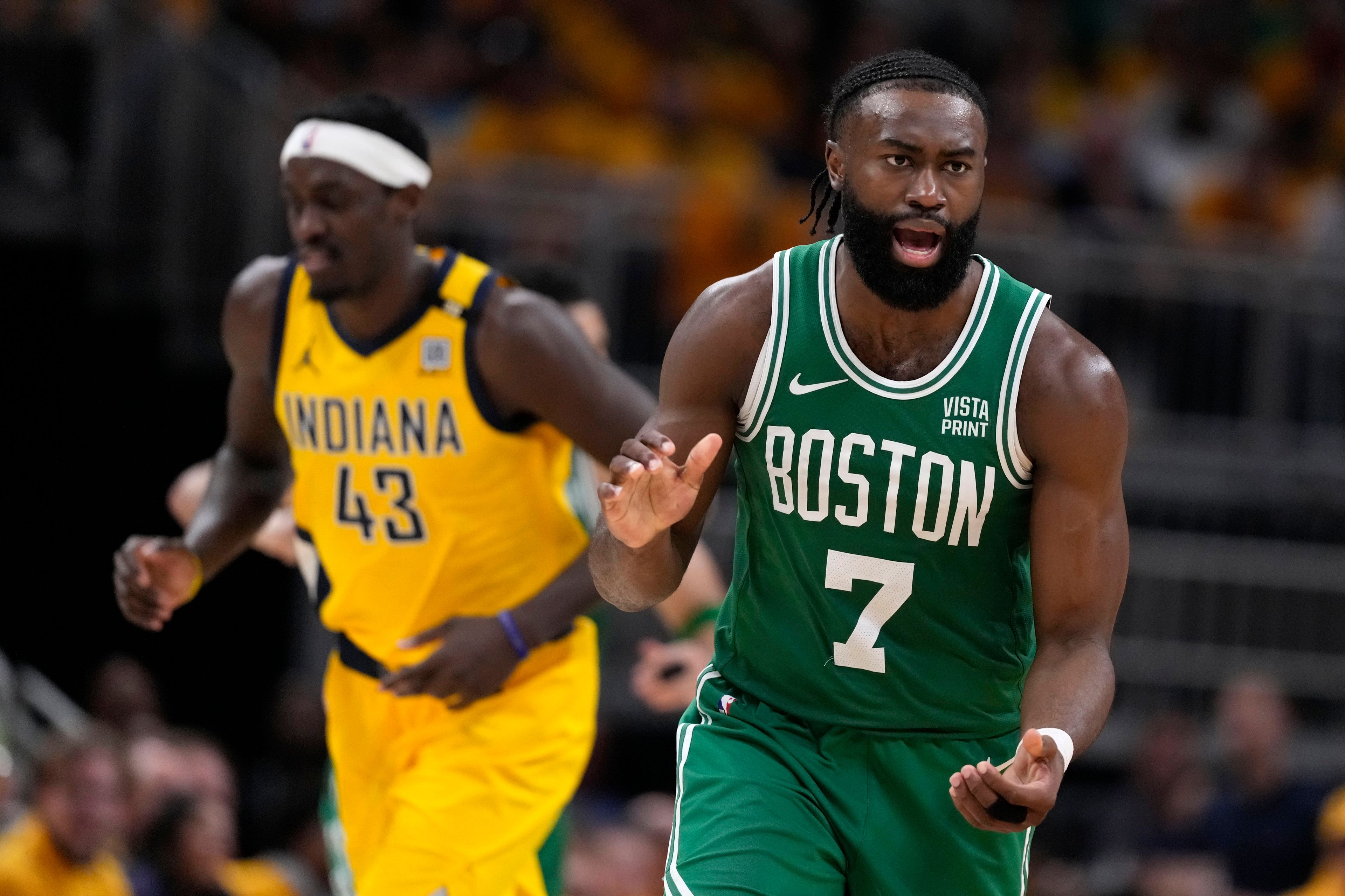 Boston Celtics guard Jaylen Brown (7) reacts in front of Indiana Pacers forward Pascal Siakam (43) after making a basket during the second half of Game 4 of the NBA Eastern Conference basketball finals, Monday, May 27, 2024, in Indianapolis. (AP Photo/Michael Conroy)