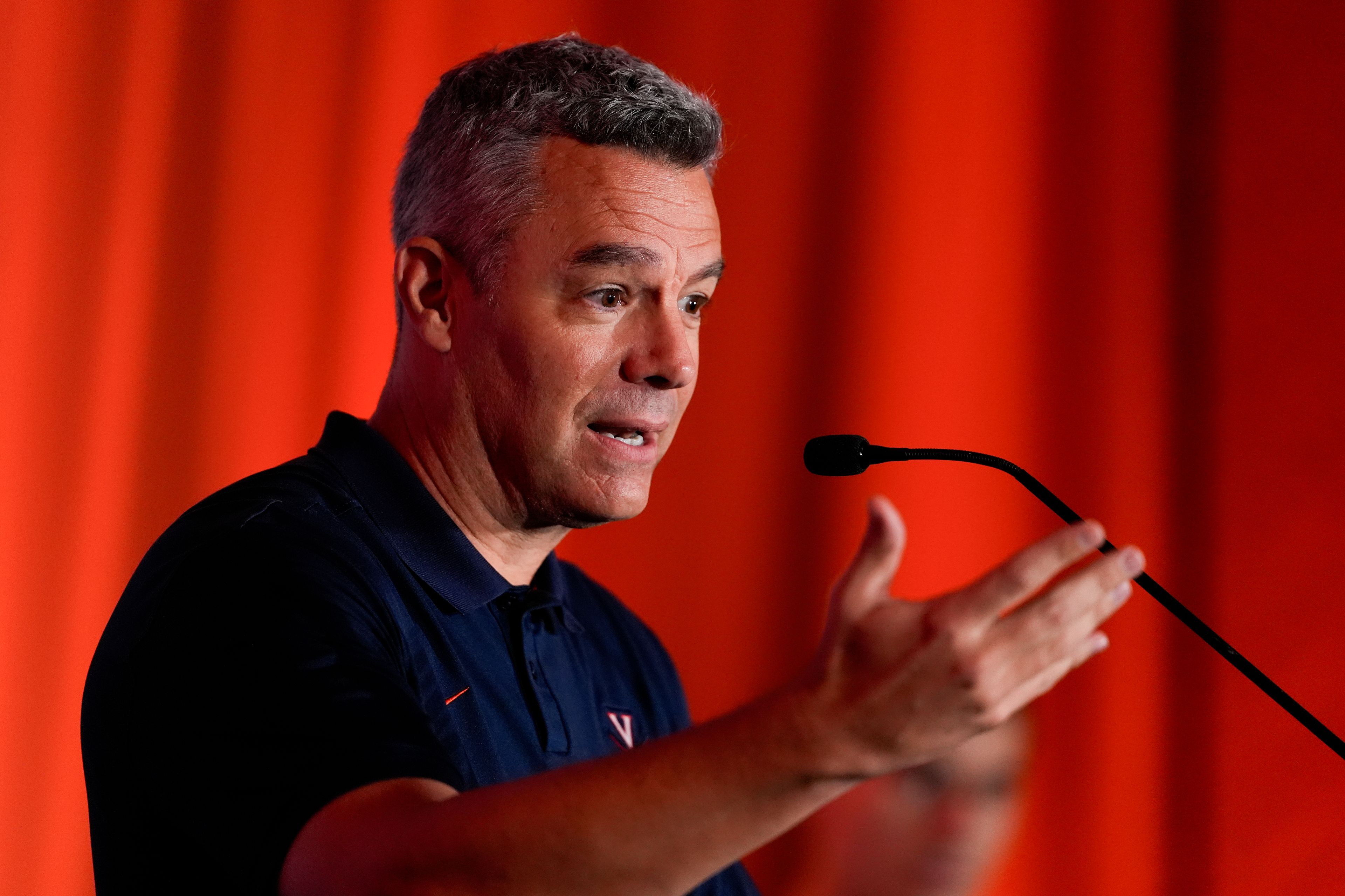 Virginia head coach Tony Bennett speaks during a ACC men's NCAA college basketball media day, Thursday, Oct. 10, 2024, in Charlotte, N.C. (AP Photo/Chris Carlson)