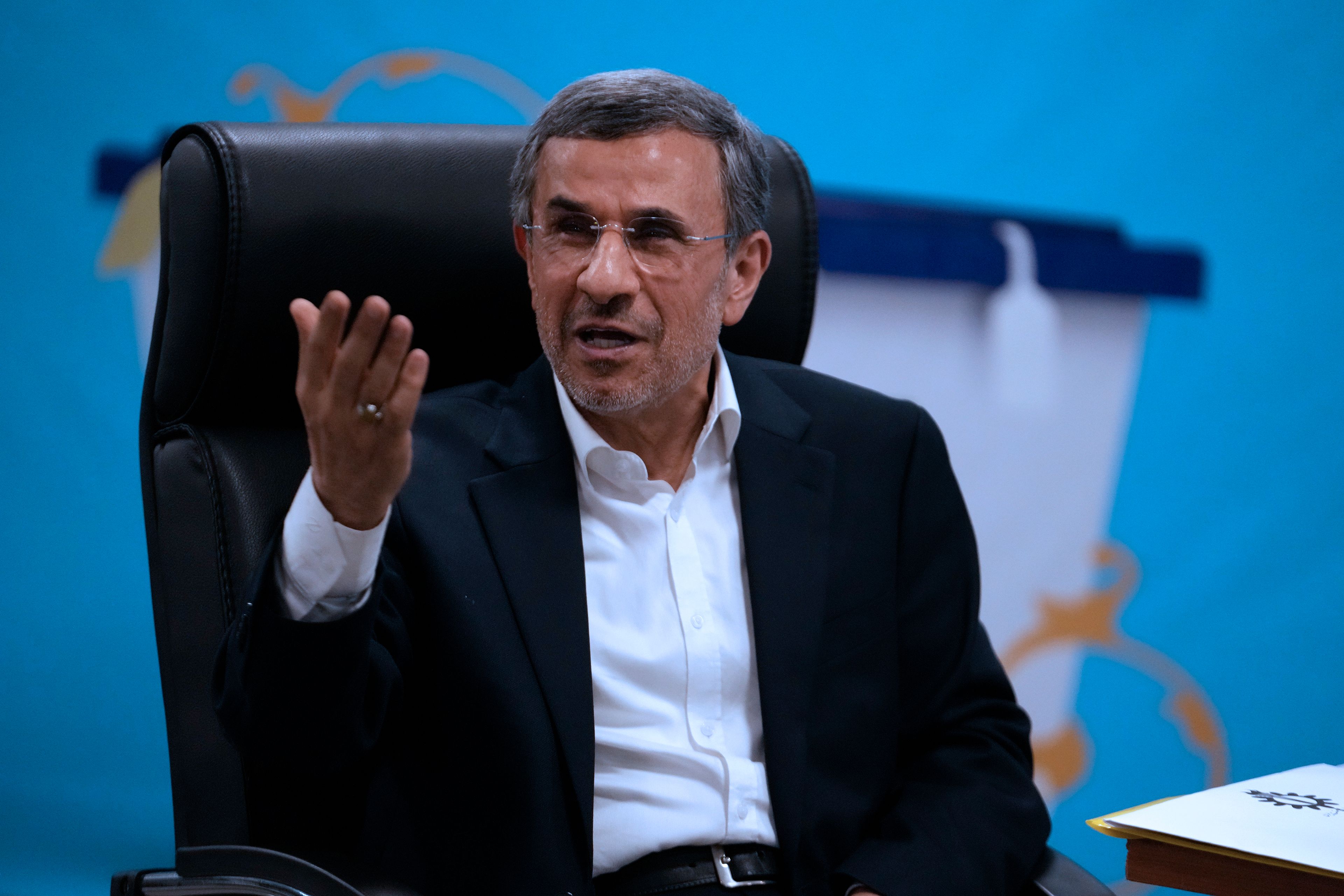 Iran's hard-line former President Mahmoud Ahmadinejad gestures while registering his name as a candidate for the June 28 presidential election at the Interior Ministry, in Tehran, Iran, Sunday, June 2, 2024. Iran's Guardian Council on Sunday, June 9, barred former President Mahmoud Ahmadinejad, a firebrand populist known for the crackdown that followed his disputed 2009 re-election, from running in the the country's presidential election.