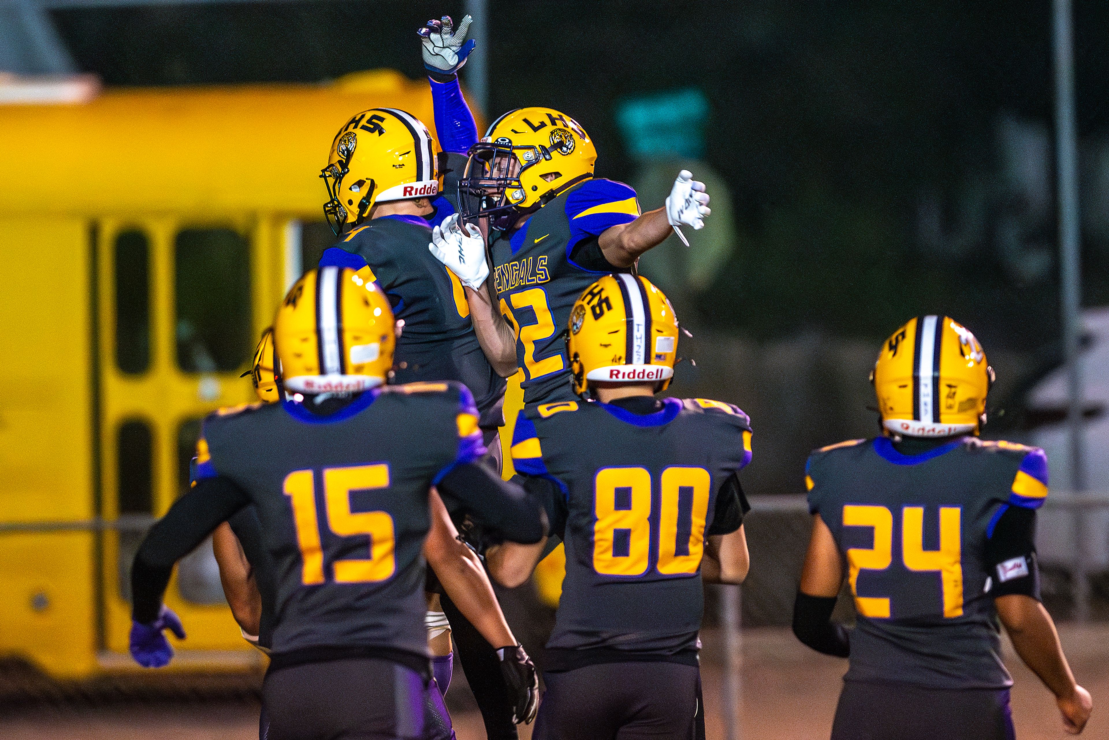 Lewiston players celebrate a touchdown against Hermiston during a nonconference game at Bengal Field Friday in Lewiston.,