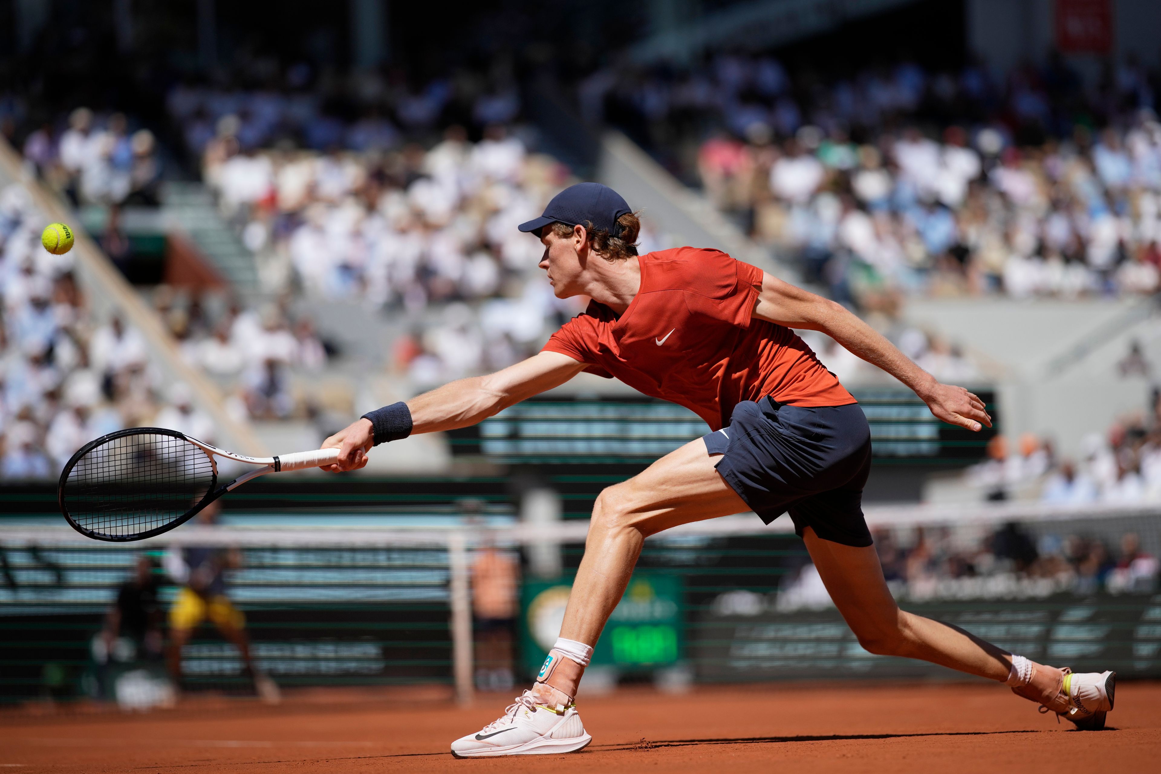 Italy's Jannik Sinner plays a shot against Spain's Carlos Alcaraz during their semifinal match of the French Open tennis tournament at the Roland Garros stadium in Paris, Friday, June 7, 2024.