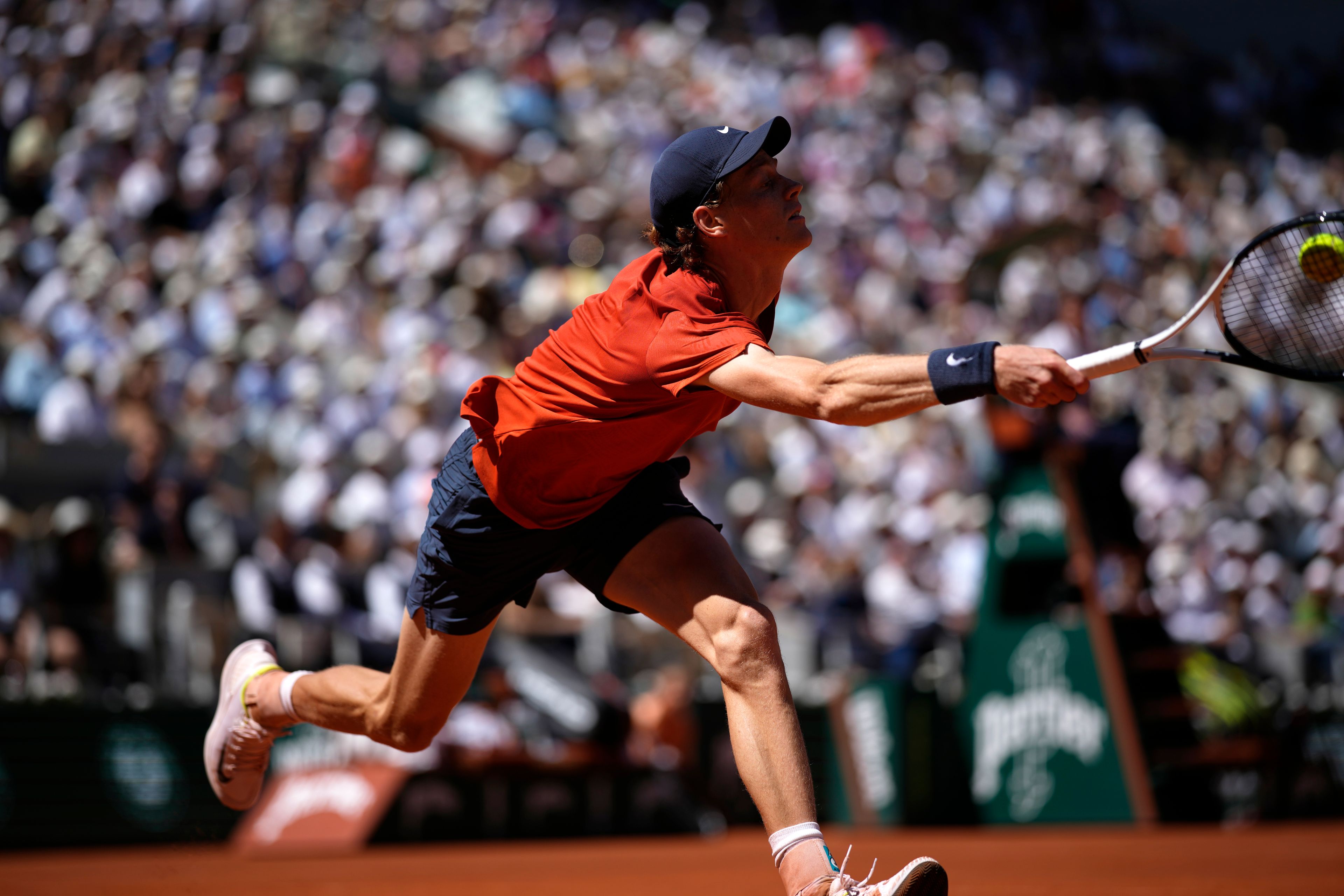 Italy's Jannik Sinner plays a shot against Spain's Carlos Alcaraz during their semifinal match of the French Open tennis tournament at the Roland Garros stadium in Paris, Friday, June 7, 2024.