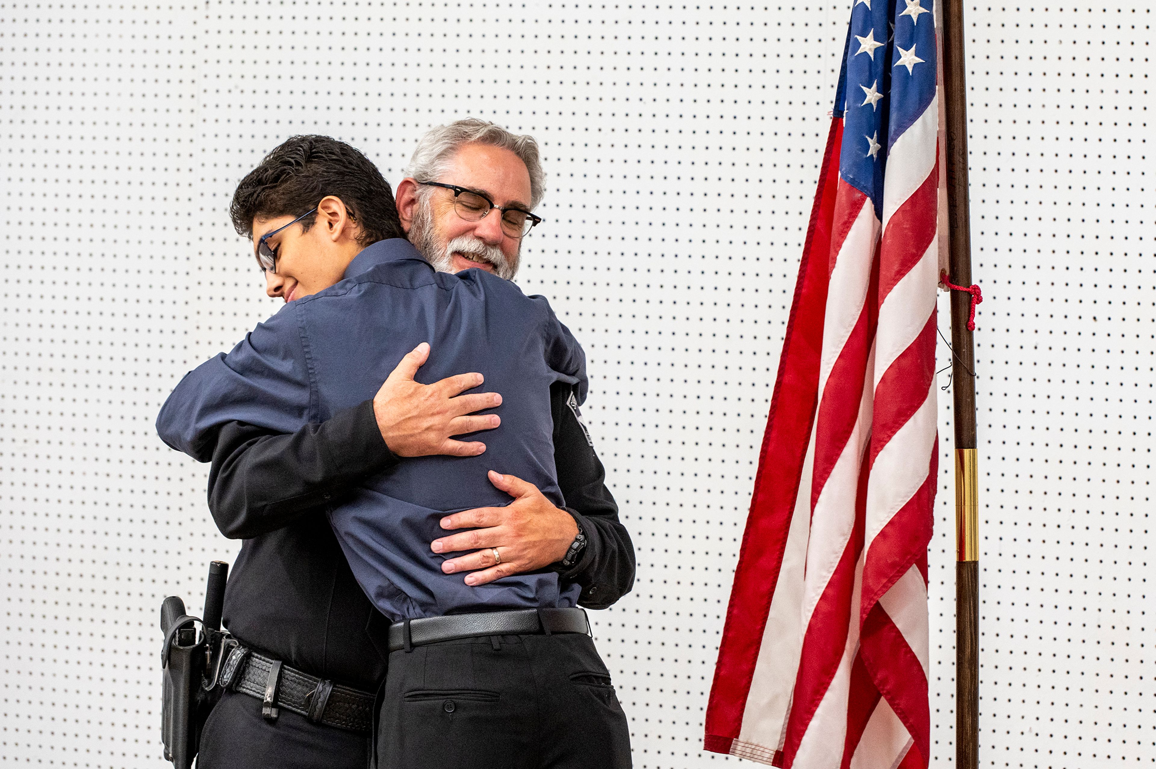 Lt. Brannon Jordan hugs his son, Braden, 16, during a party Thursday celebrating his retirement from the Latah County Sheriff’s Office at the Latah County Fair Office in Moscow. Jordan worked in the department for 32 years.