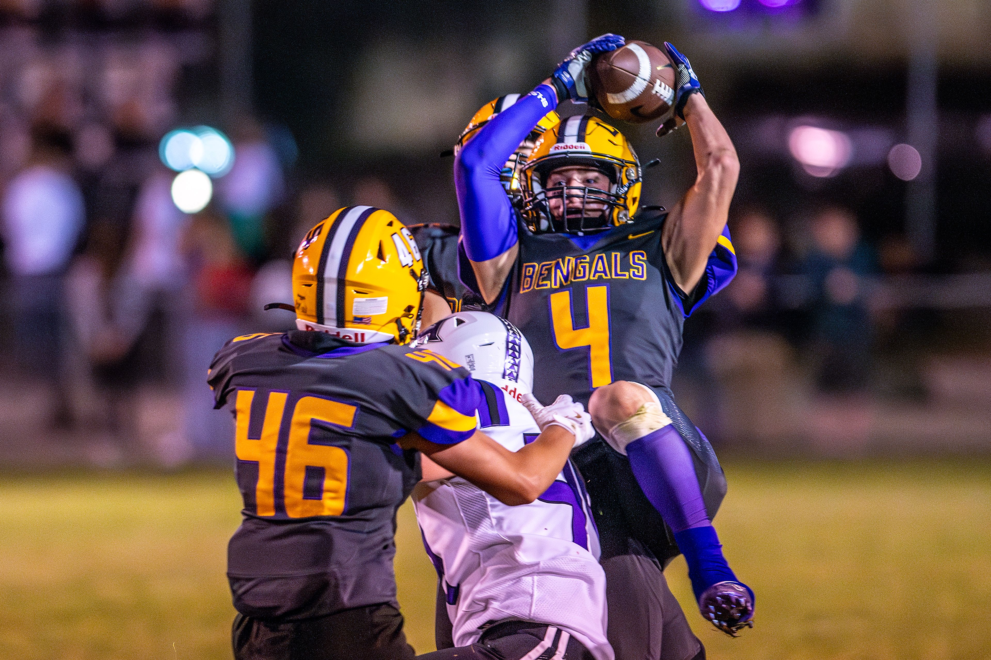 Lewiston defensive back Noah Carpenter intercepts a Hermiston pass during a nonconference game at Bengal Field Friday in Lewiston.,