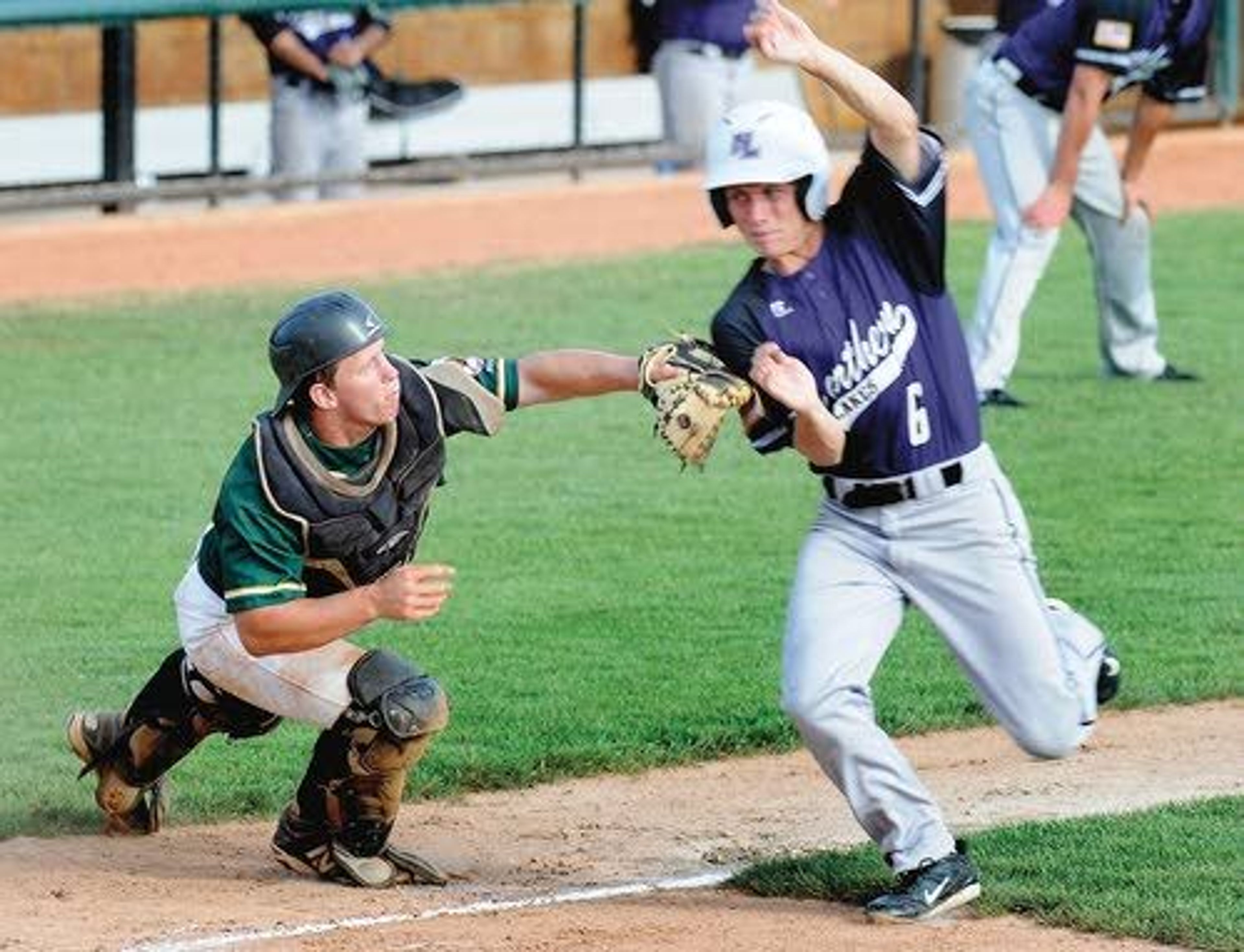 Lewis-Clark Twins catcher Jessup Scott tags out Northern Lakes’ Sam Schoenberg as he tries to tie the game in the top of the third inning at Harris Field. Scott also had a big night batting as he helped the Twins sweep the visitors from Rathdrum by the scores of 11-1 and 8-4 on Tuesday. For more, see page 2B.