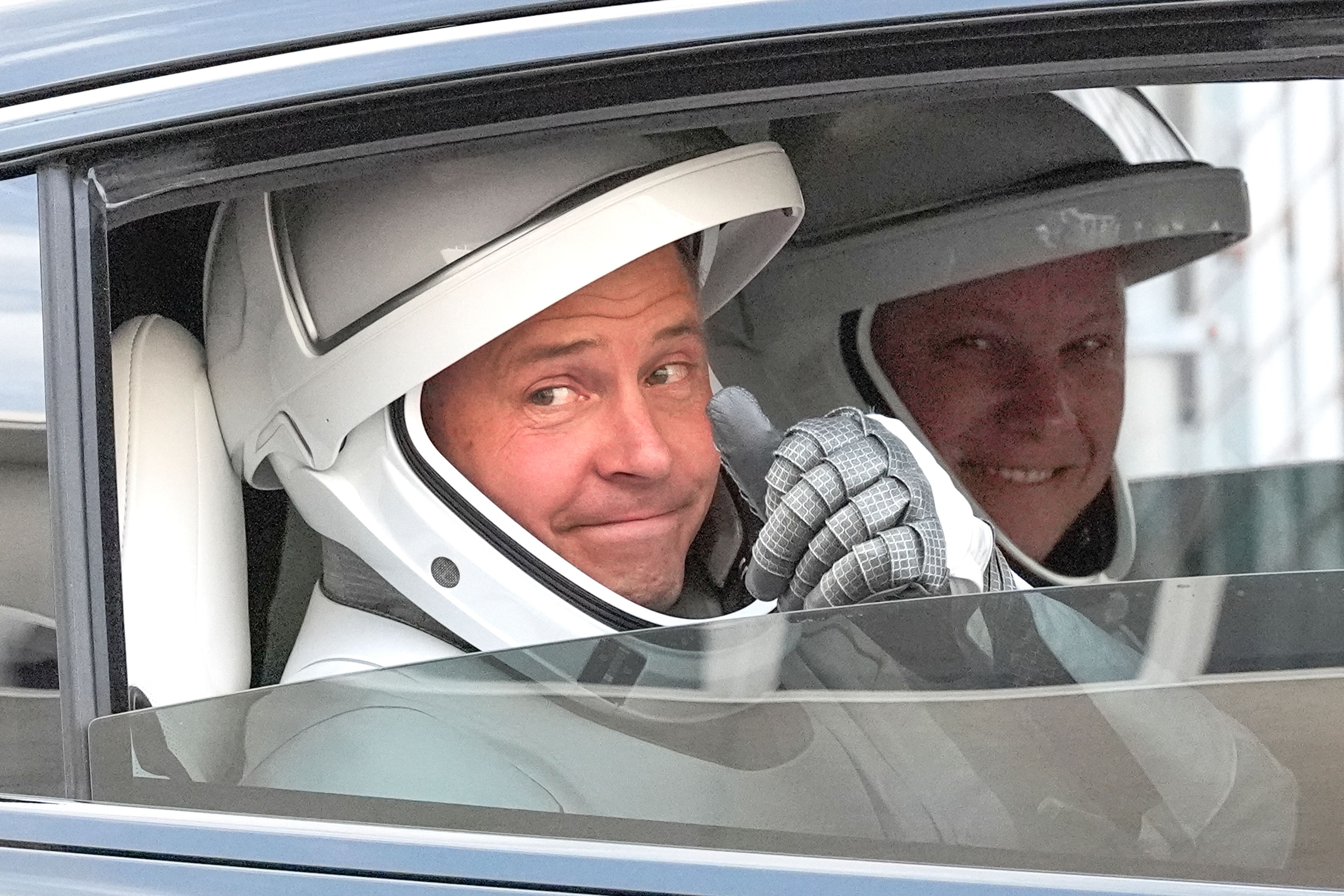 NASA astronaut Nick Hague, left, and Roscosmos cosmonaut Aleksandr Gorbunov, left, gives a thumbs up as they leave the Operations and Checkout Building on their way to Launch Complex 40 for a mission to the International Space Station Saturday, Sept. 28, 2024 at Cape Canaveral, Fla., (AP Photo/John Raoux)