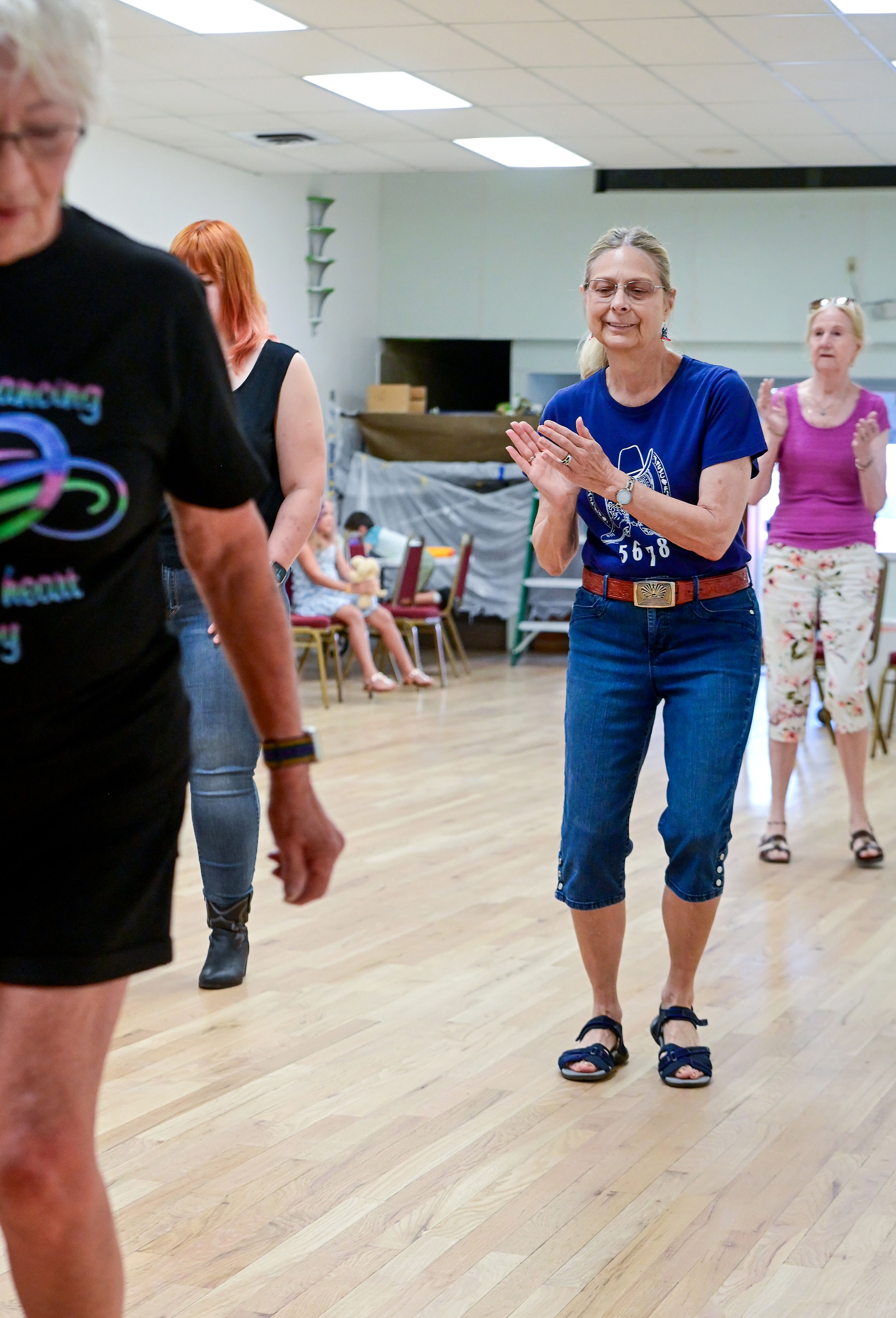 Pam Moore, center, watches the steps of those around her while leading a weekly line dance class at the Sixth Street Senior Center on Wednesday in Clarkston.