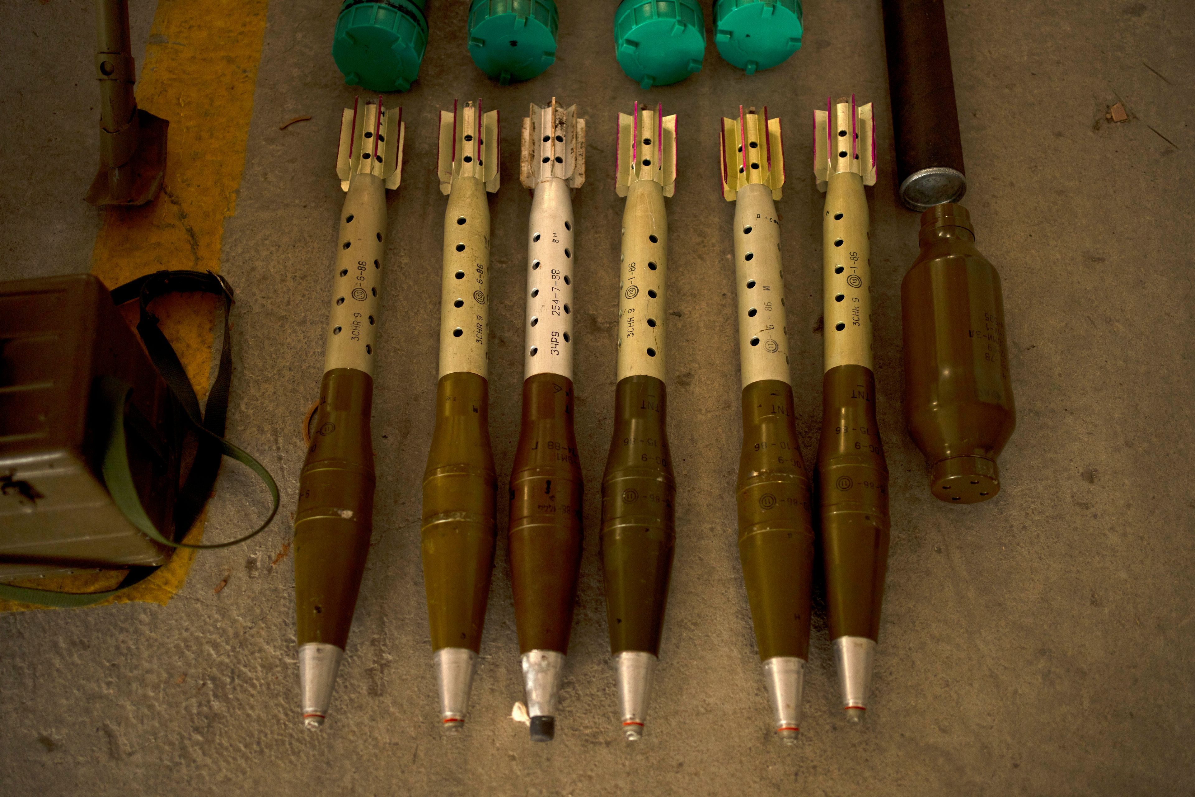 The Israeli Defense Forces display weapons seized in on a base in southern Israel, Wednesday, Oct. 9, 2024. (AP Photo/Maya Alleruzzo)