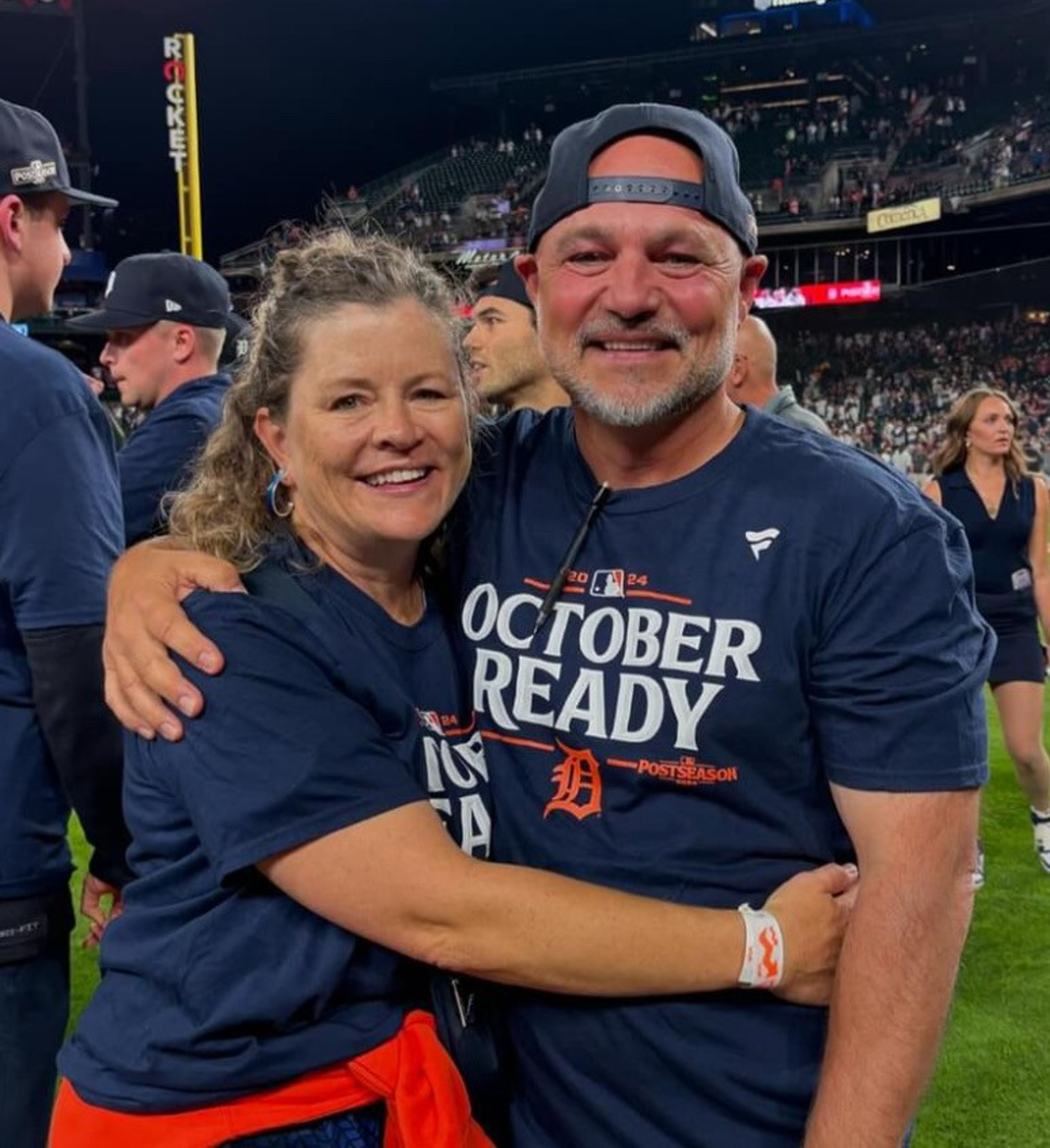 Robin and Susie Lund pose for a photo after the Tigers clinched a spot in the 2024 MLB playoffs on Sept. 27, 2024, in Detroit.