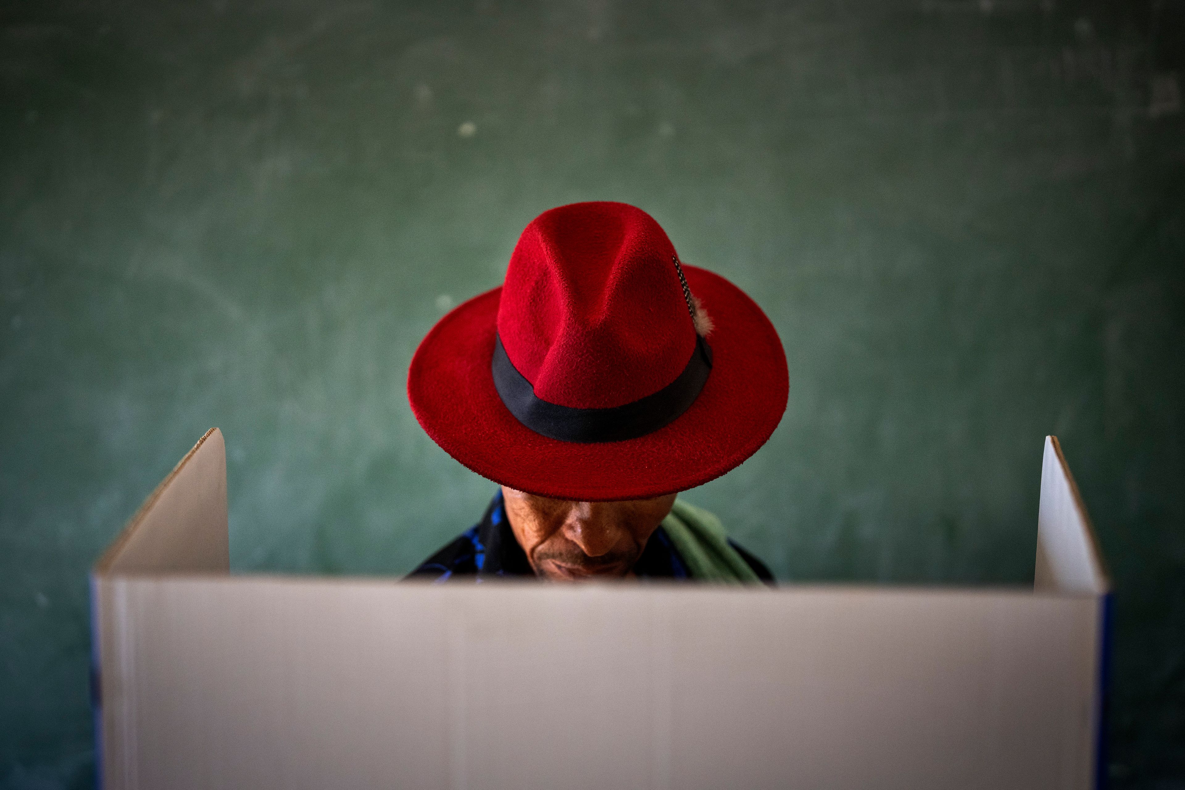 A voter fills out a ballot paper during general elections in Nkandla, Kwazulu Natal, South Africa, Wednesday May 29, 2024.