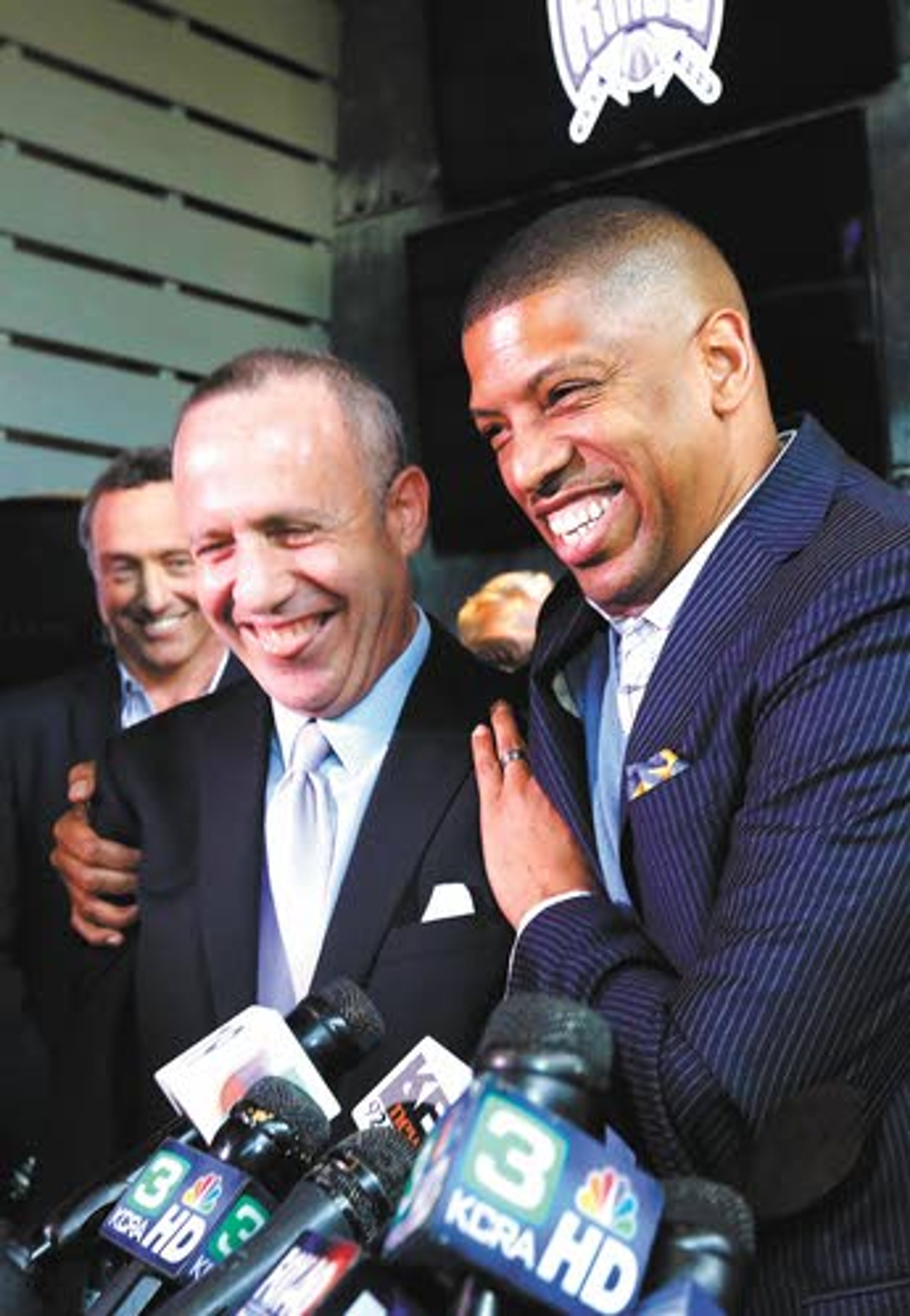 Sacramento mayor Kevin Johnson (right) hugs Senate President Pro Tem Darrell Steinberg, D-Sacramento, at a news conference Monday in Sacramento, Calif.