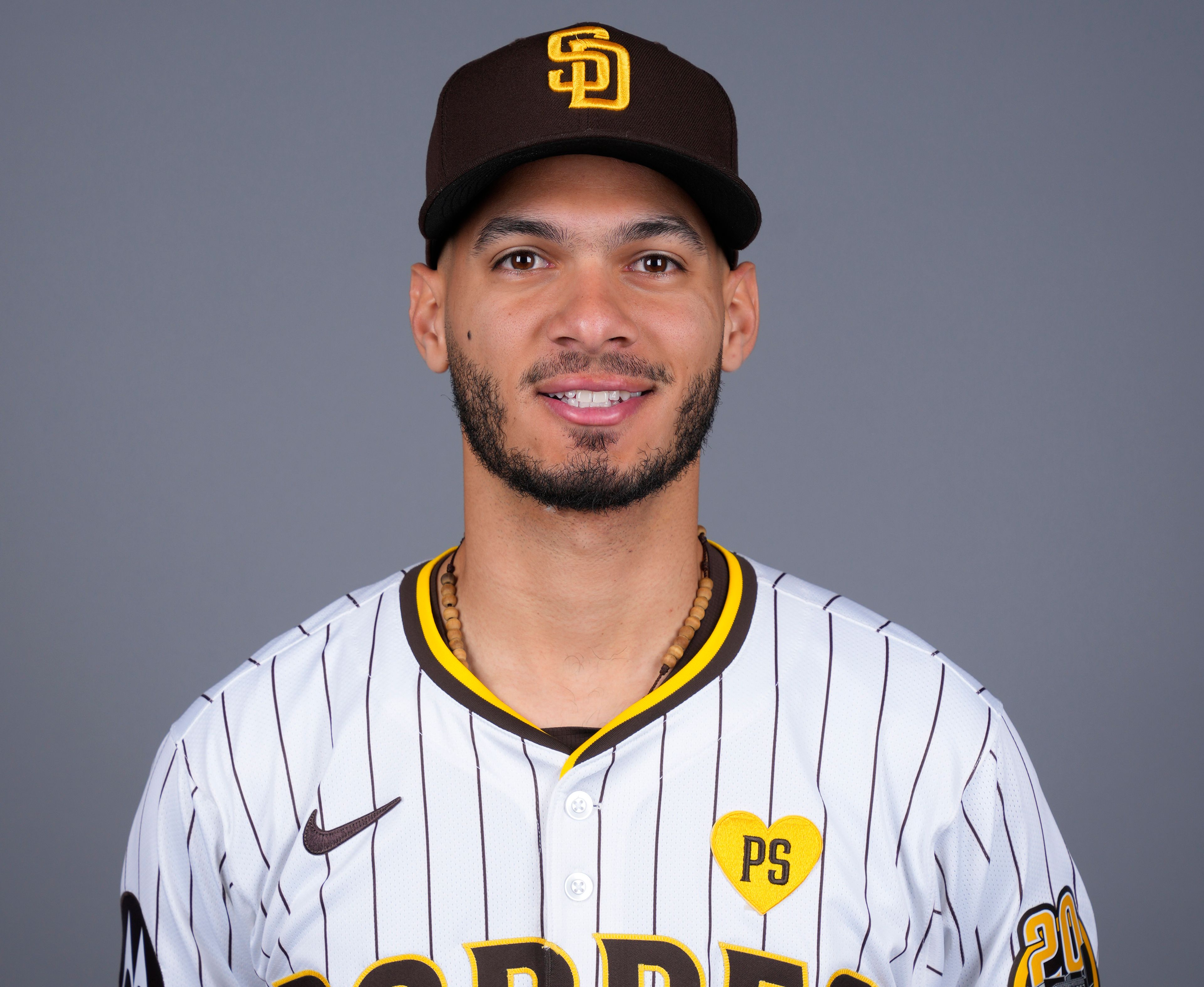 FILE - San Diego Padres baseball infielder Tucupita Marcano poses for a photo Feb. 20, 2024, in Peoria, Ariz. Major League Baseball has permanently banned Marcano, Tuesday, June 4, 2024, for betting on baseball and suspended the four other players for one year after finding the players placed unrelated bets with a legal sportsbook.