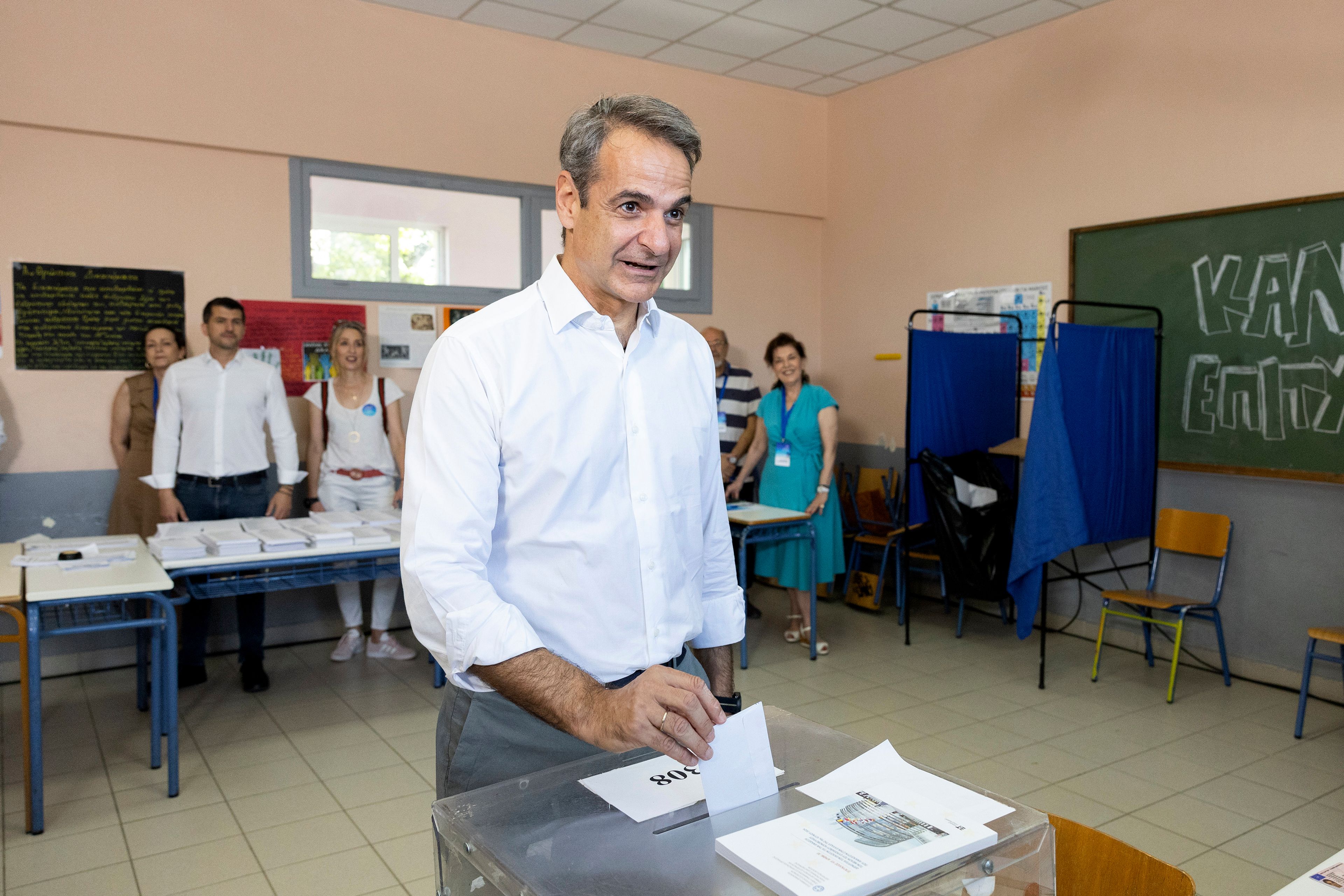 Greece's Prime Minister Kyriakos Mitsotakis casts his ballot during the European Elections in Athens, Sunday, June 9, 2024. Polling stations opened across Europe on Sunday as voters from 20 countries cast ballots in elections that are expected to shift the European Union's parliament to the right and could reshape the future direction of the world's biggest trading bloc.