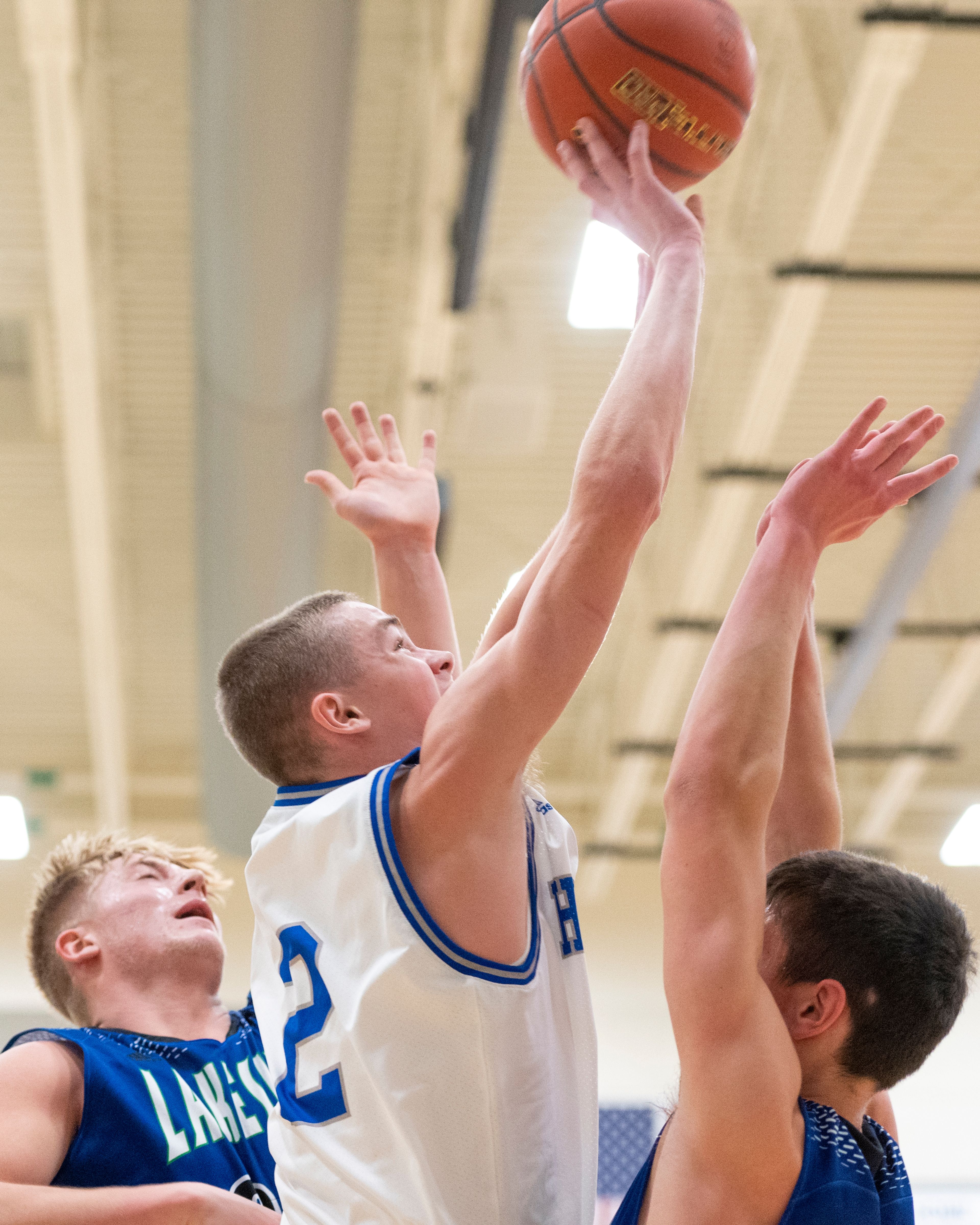 Pullman guard Jaedyn Brownl, left, shoots over two Lakeside defenders during Friday's nonleague game.