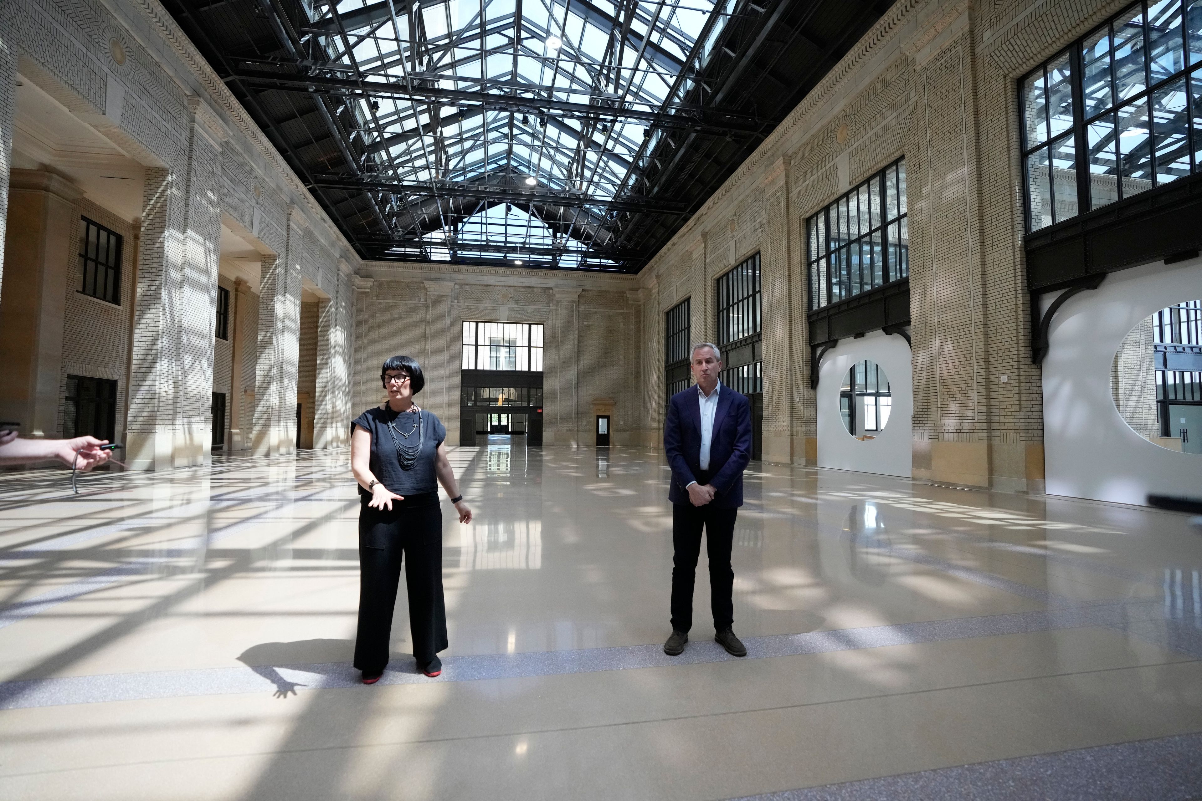 Michigan Central Station Head of Place Melissa Dittmer, left, and CEO Josh Sirefman give a tour of the train station, Monday, May 13, 2024 in Detroit. A once hulking scavenger-ravaged monolith that symbolized Detroit's decline reopens this week after a massive six-year multimillion dollar renovation by Ford Motor Co., which restored the Michigan Central Station to its past grandeur with a focus squarely on the future of mobility.