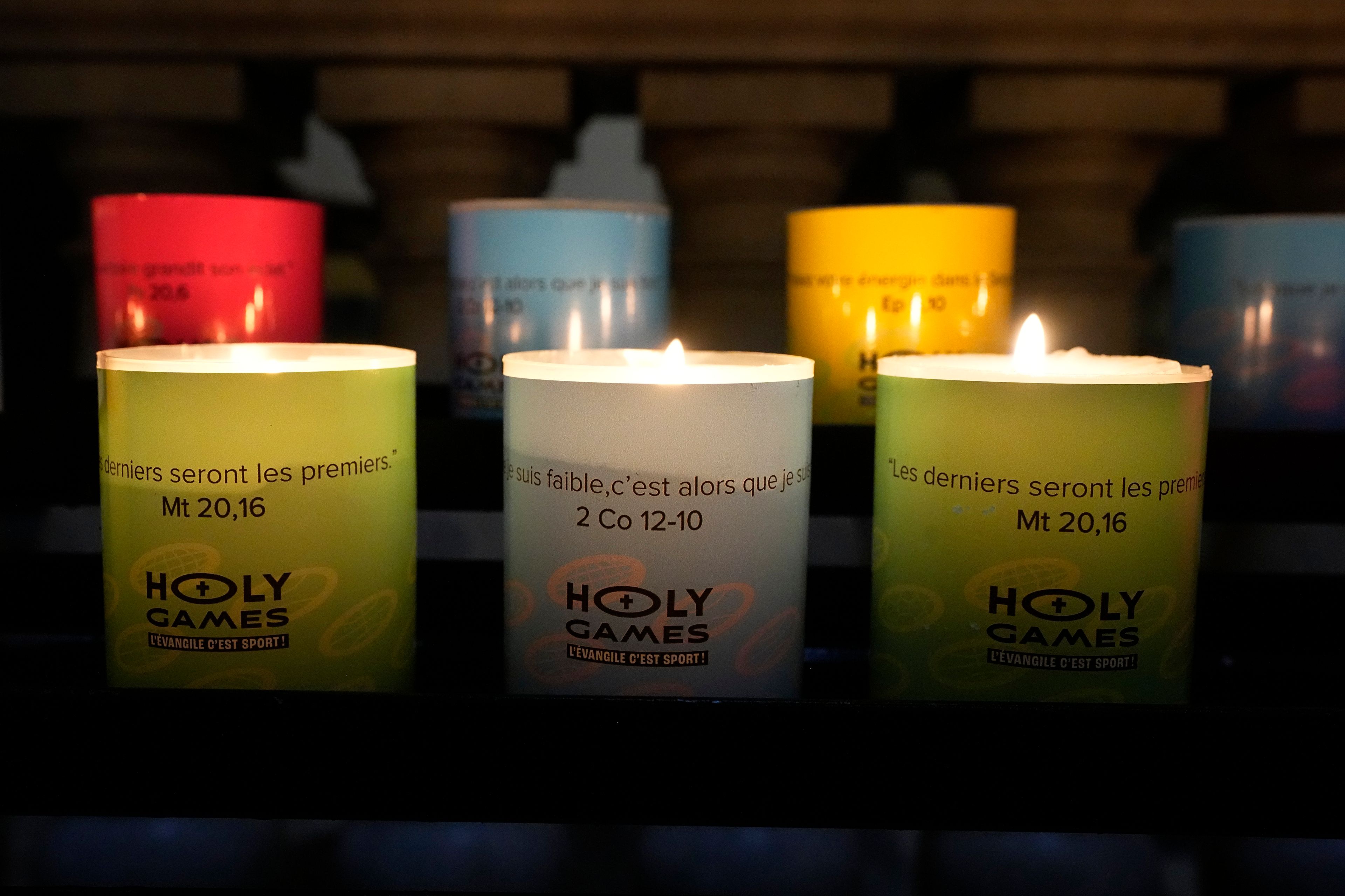 Candles light at "Our Lady of Athletes" chapel inside the Madeleine church, Thursday, May 30, 2024 in Paris. France's Catholic Bishops Conference has launched a nationwide "Holy Games" initiative. Since last September, it has set up the "Our Lady of Athletes" chapel in an iconic downtown Paris church, La Madeleine.