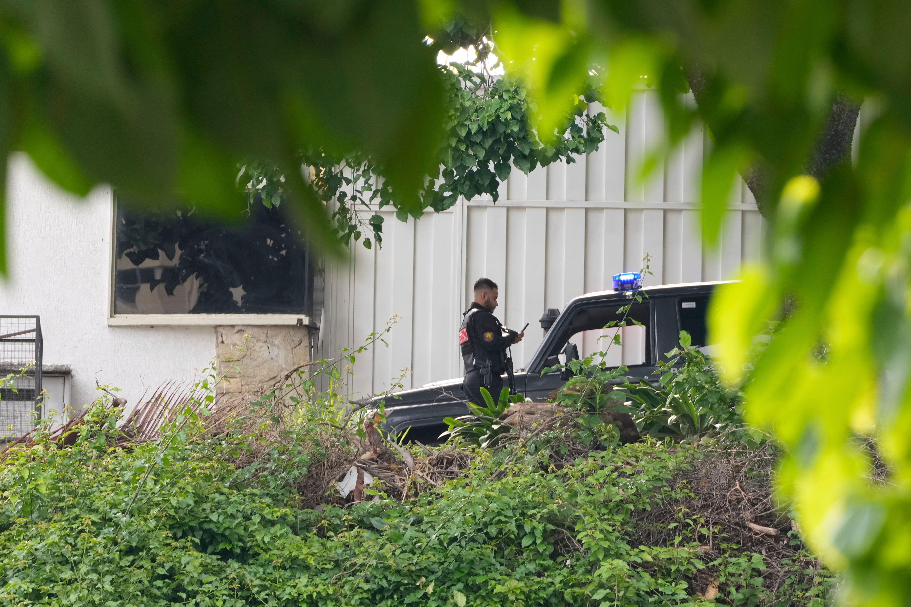 Police guard Argentina's embassy in Caracas, Venezuela, Saturday, Sept. 7, 2024.