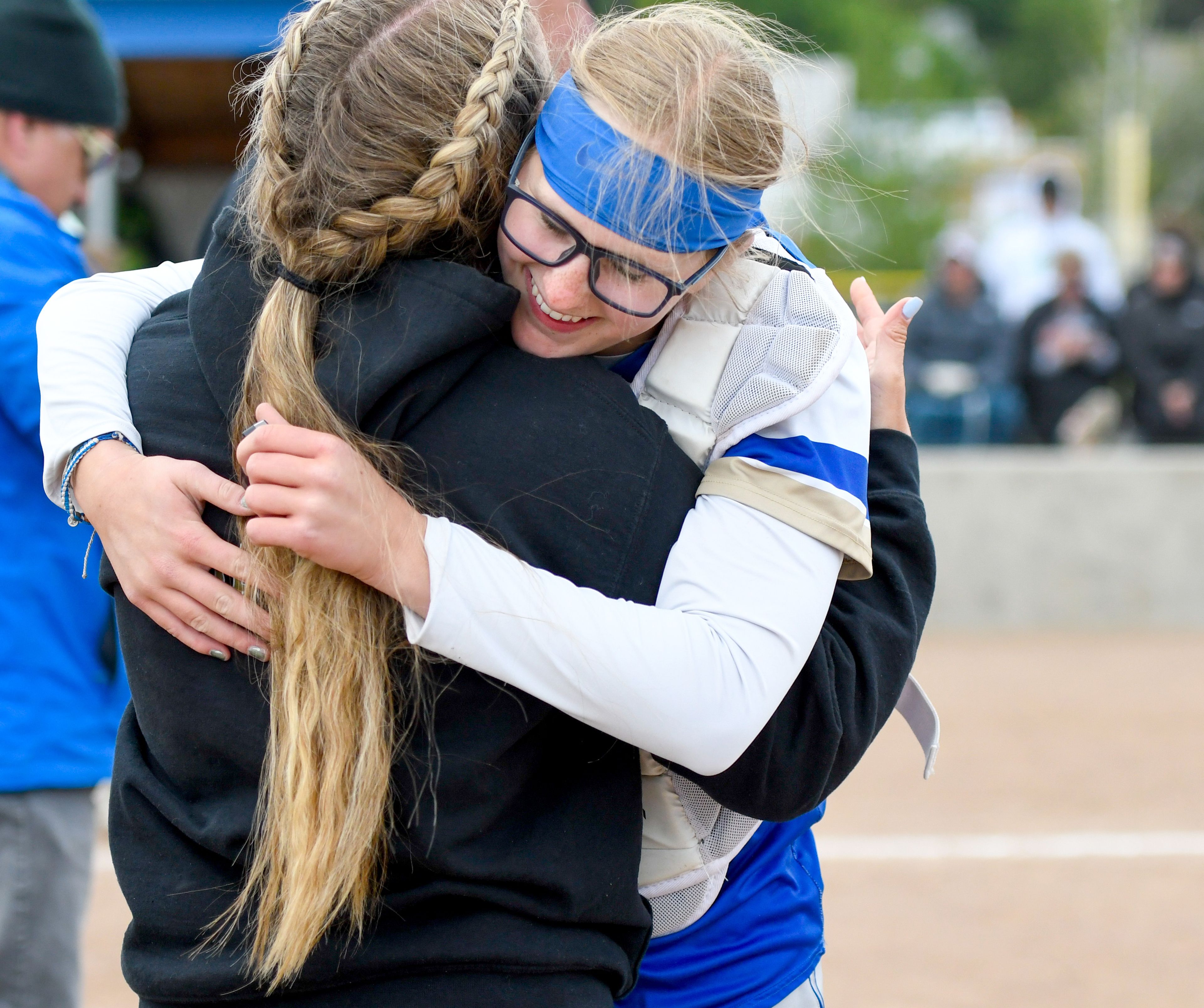 Genesee coach Charise Burke embraces Rylie Baysinger during the award presentation for the team after winning an Idaho Class 1A state championship game Friday in Genesee.