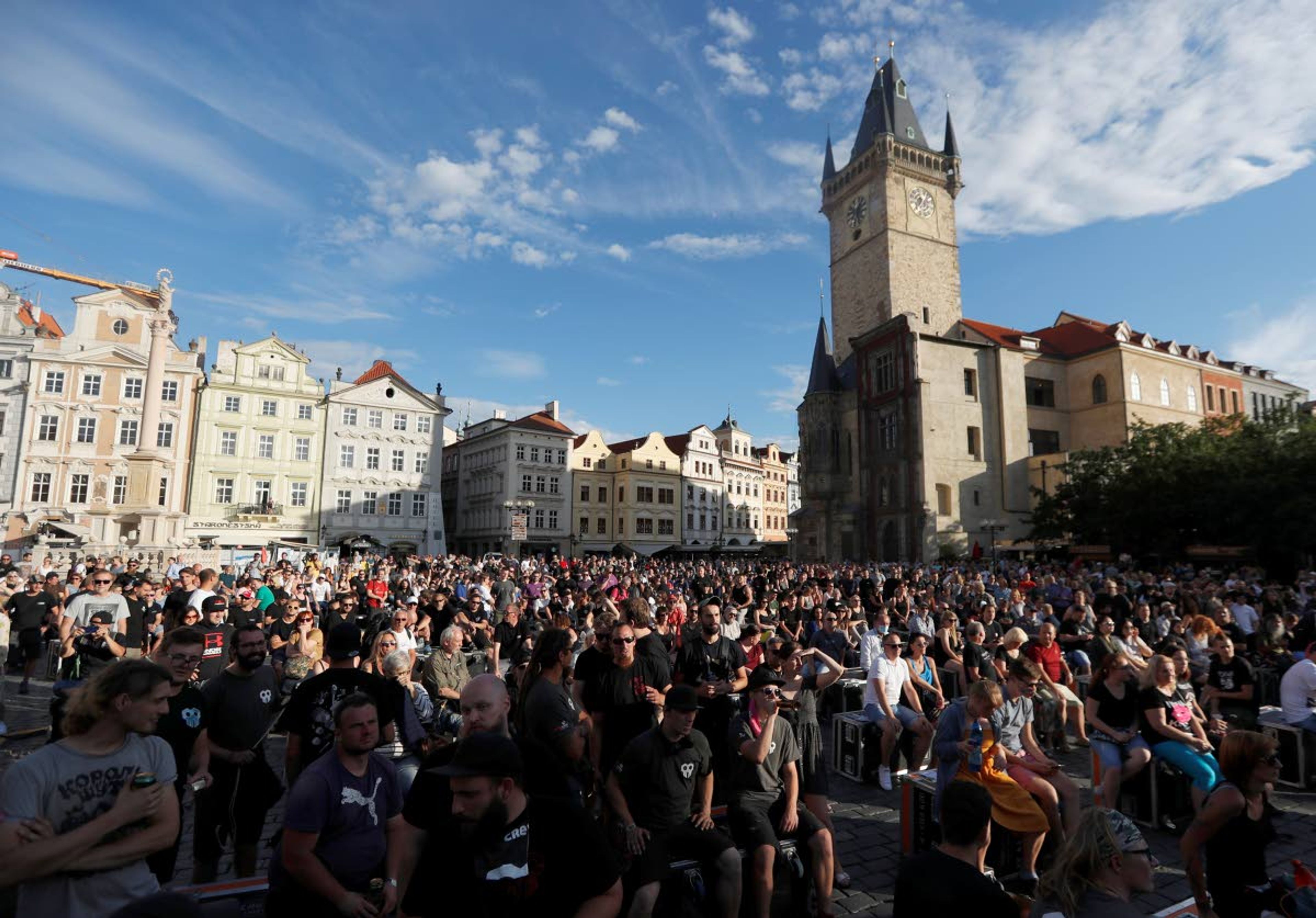 People gather for a demonstration in Prague, Czech Republic, Monday, July 27, 2020. Hundreds of musicians, concert promoters, club owners and other involved in the music industry rallied in Prague's Old Town Square to protest against government restrictions due to the coronavirus pandemic that they say ruin their business. (AP Photo/Petr David Josek)