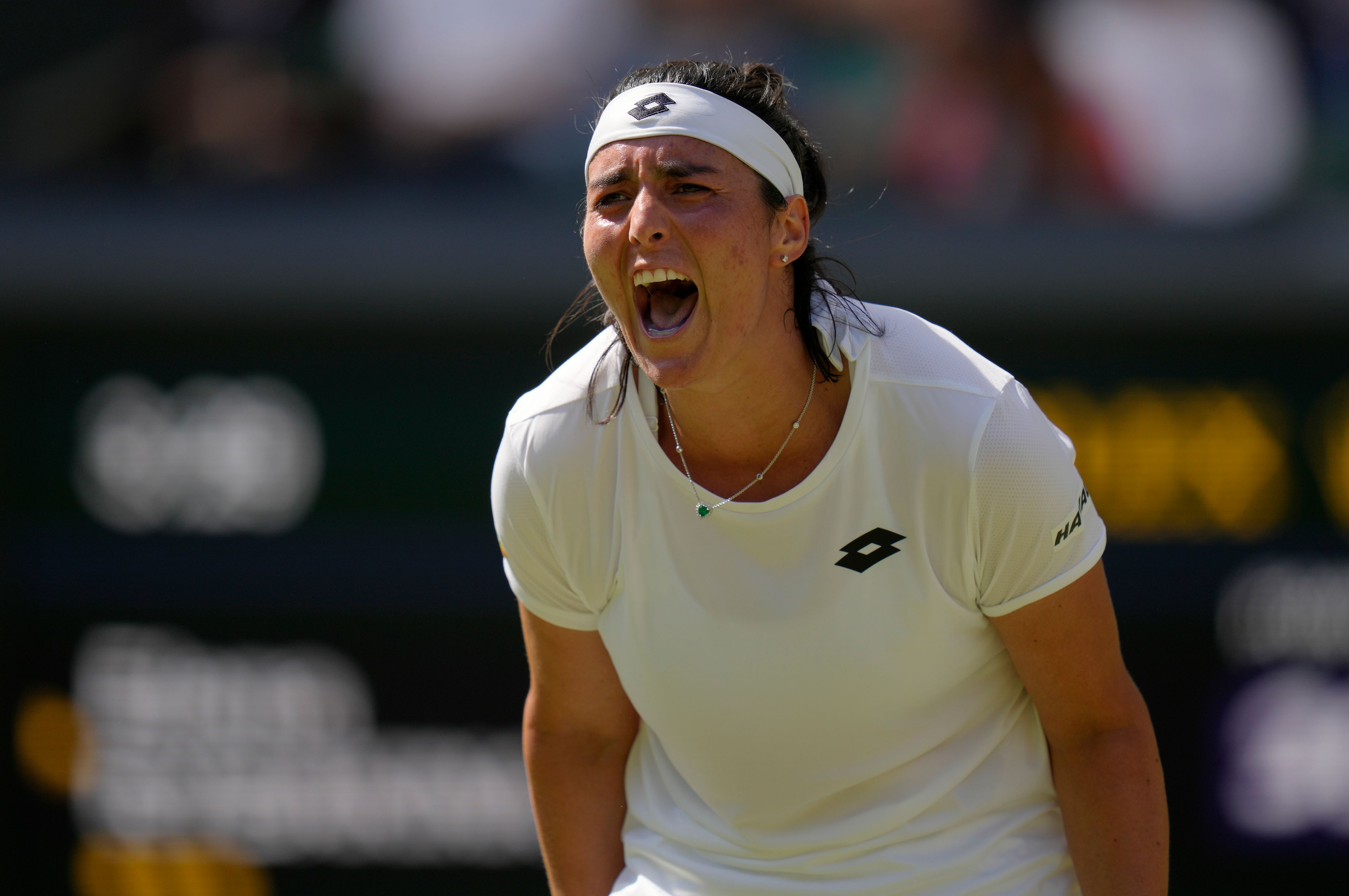 Tunisia's Ons Jabeur reacts after losing a point to Kazakhstan's Elena Rybakina in the final of the women's singles on day thirteen of the Wimbledon tennis championships in London, Saturday, July 9, 2022. (AP Photo/Kirsty Wigglesworth)