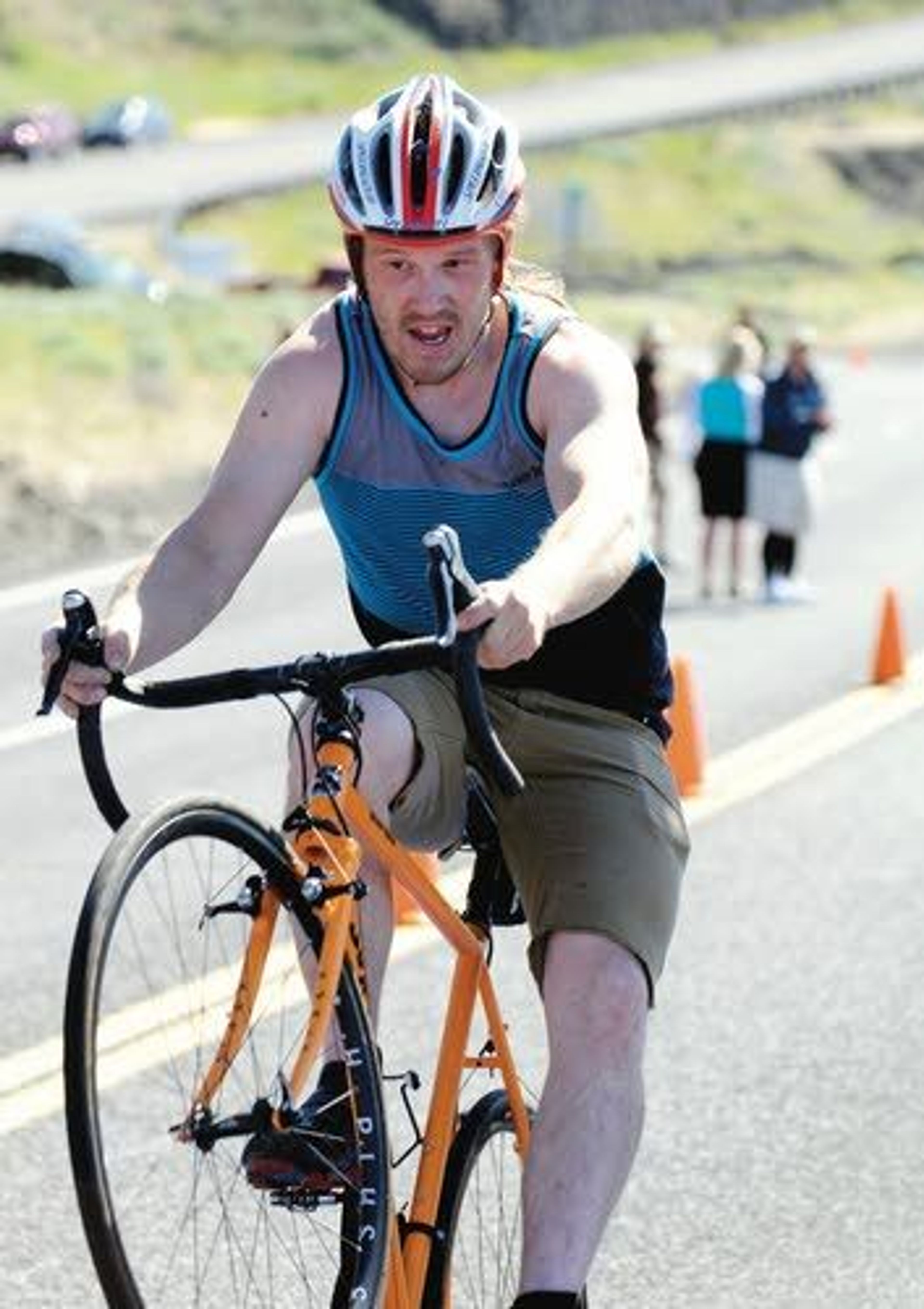 Justin Covey celebrates crossin gthe line with a wheelie at the top of the Lewiston Hill Saturday.