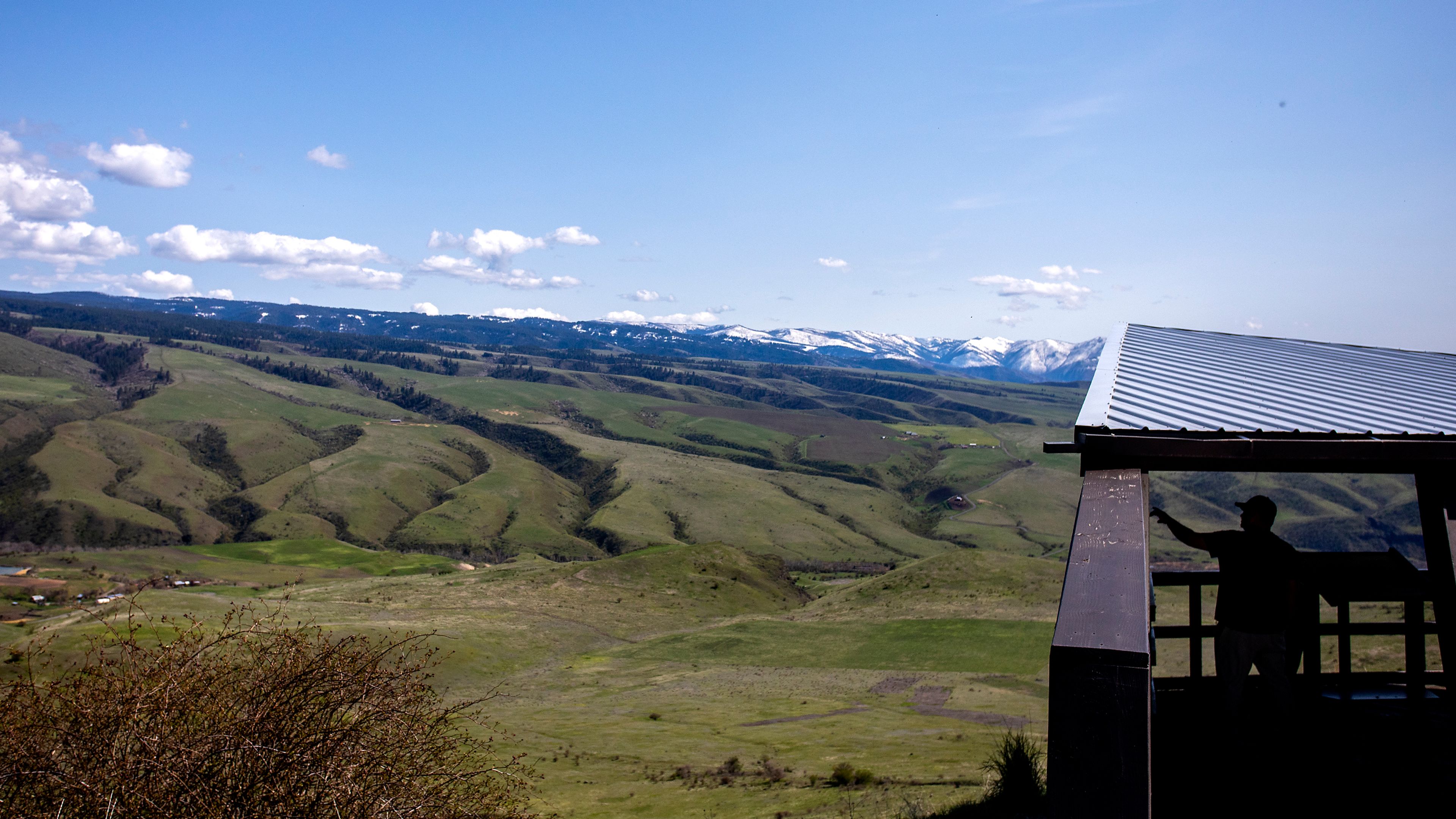 A man looks at the instructional panels at the White Bird Battlefield Overlook. The canyon was the site of the initial battle in the Nez Perce War of 1877.