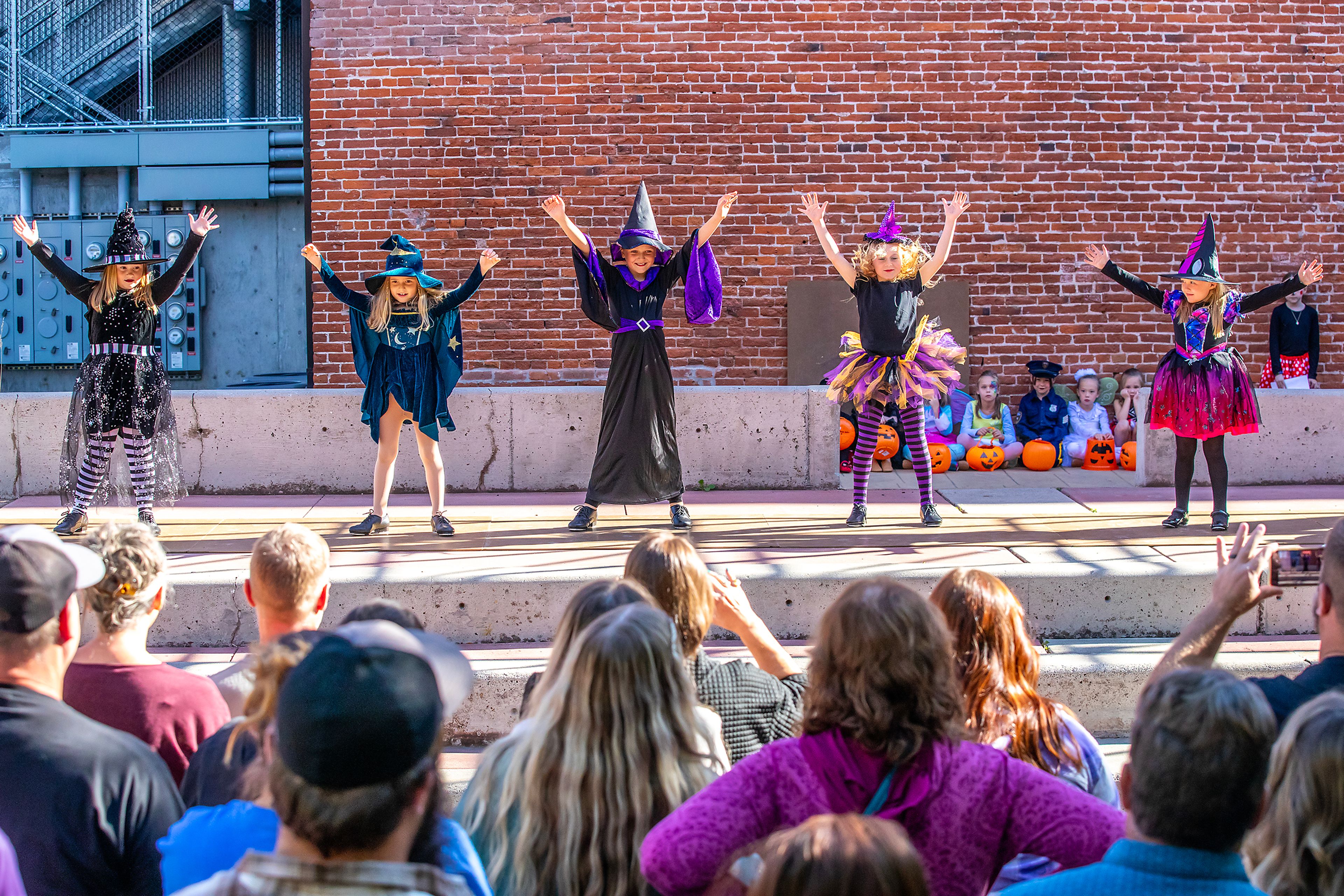 The Just for Kix Tuesday Grange Tap Class dances to the song �Working for the Witches� Saturday at Pumpkin Palooza in downtown Lewiston.,