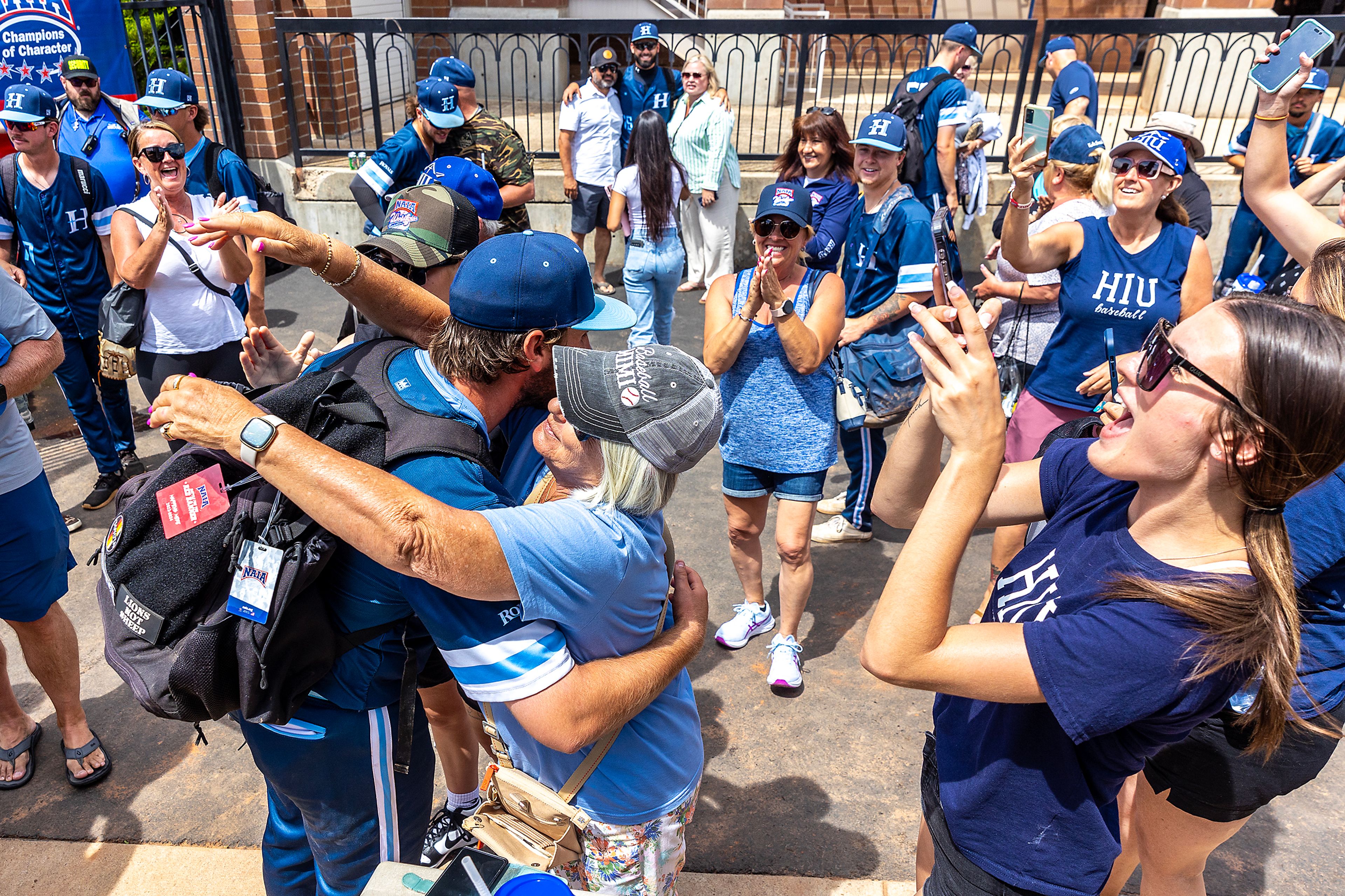 Hope International pitcher Justin Drury hugs his grandmother Marge Schowen following the Royals victory over Arizona Christian on Tuesday at the NAIA World Series in Lewiston.