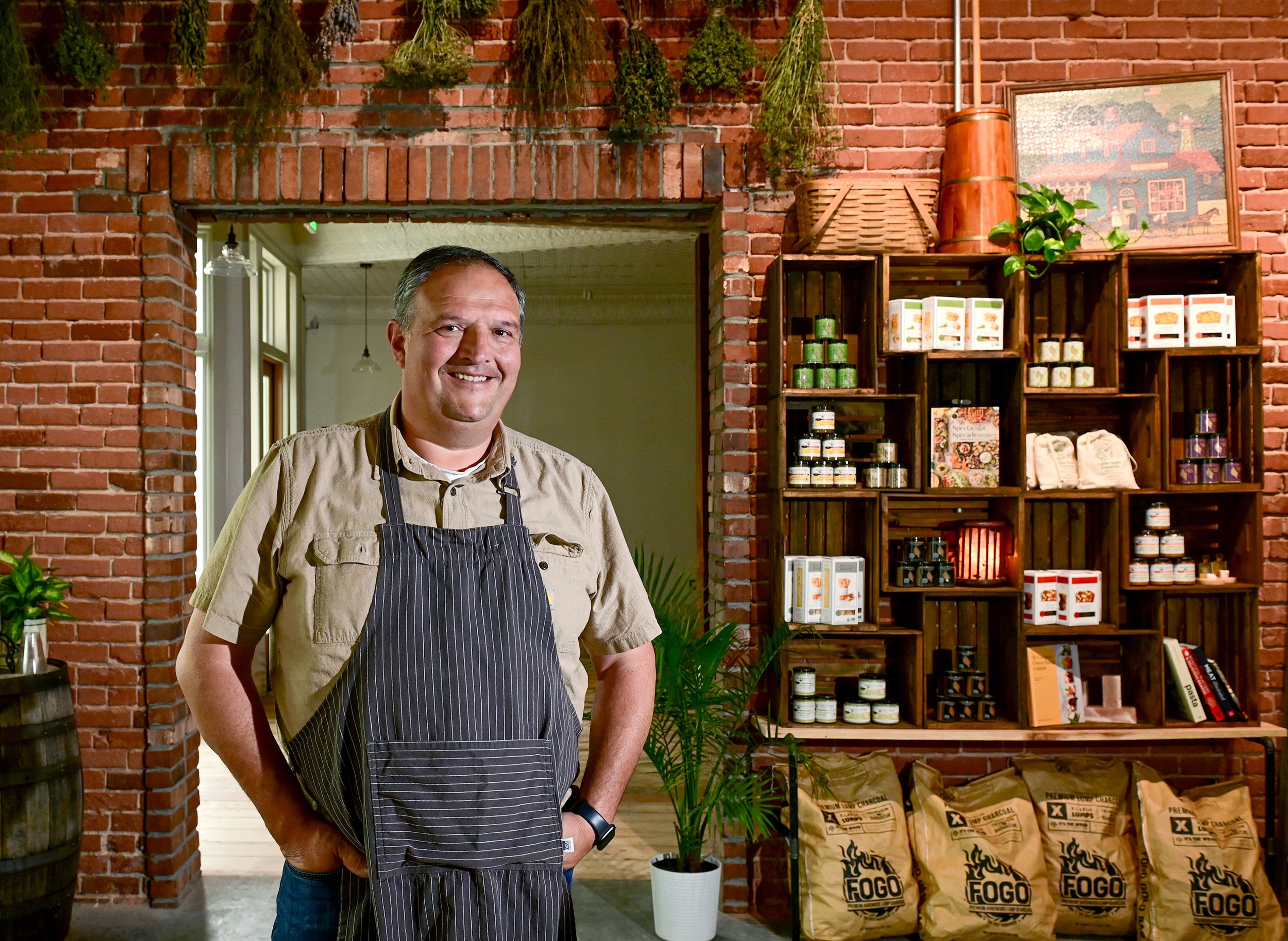 Gary Moore stands in the lobby and mercantile space of The Butcher Shop on Friday in Deary.