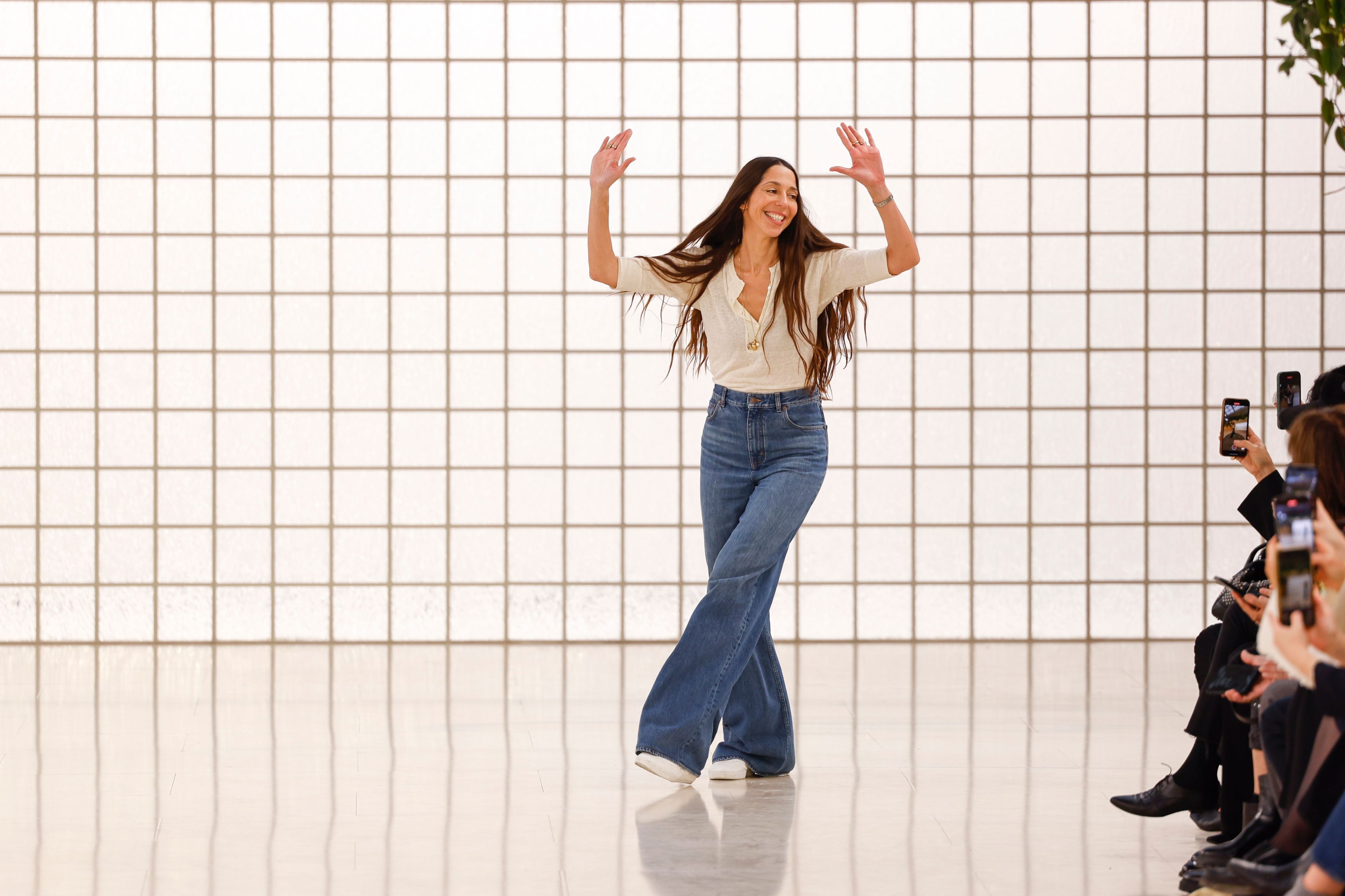 Designer Chemena Kamali accepts applause after the Chloe Spring/Summer 2025 collection presented Thursday, Sept. 26, 2024, in Paris. (Photo by Vianney Le Caer/Invision/AP)