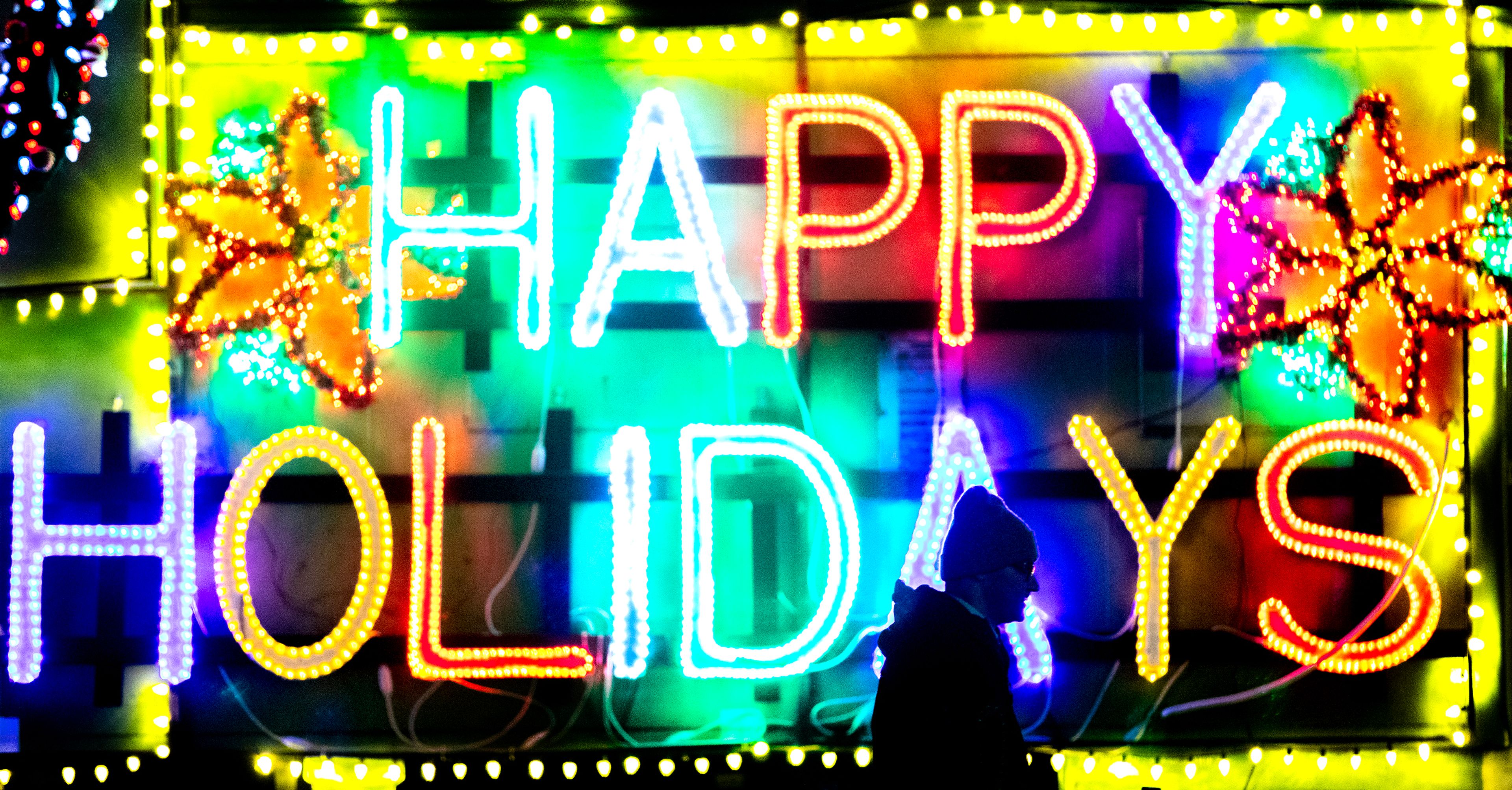 The happy holidays sign shines brightly at the Winter Spirit holiday light display Wednesday at Locomotive Park in Lewiston.