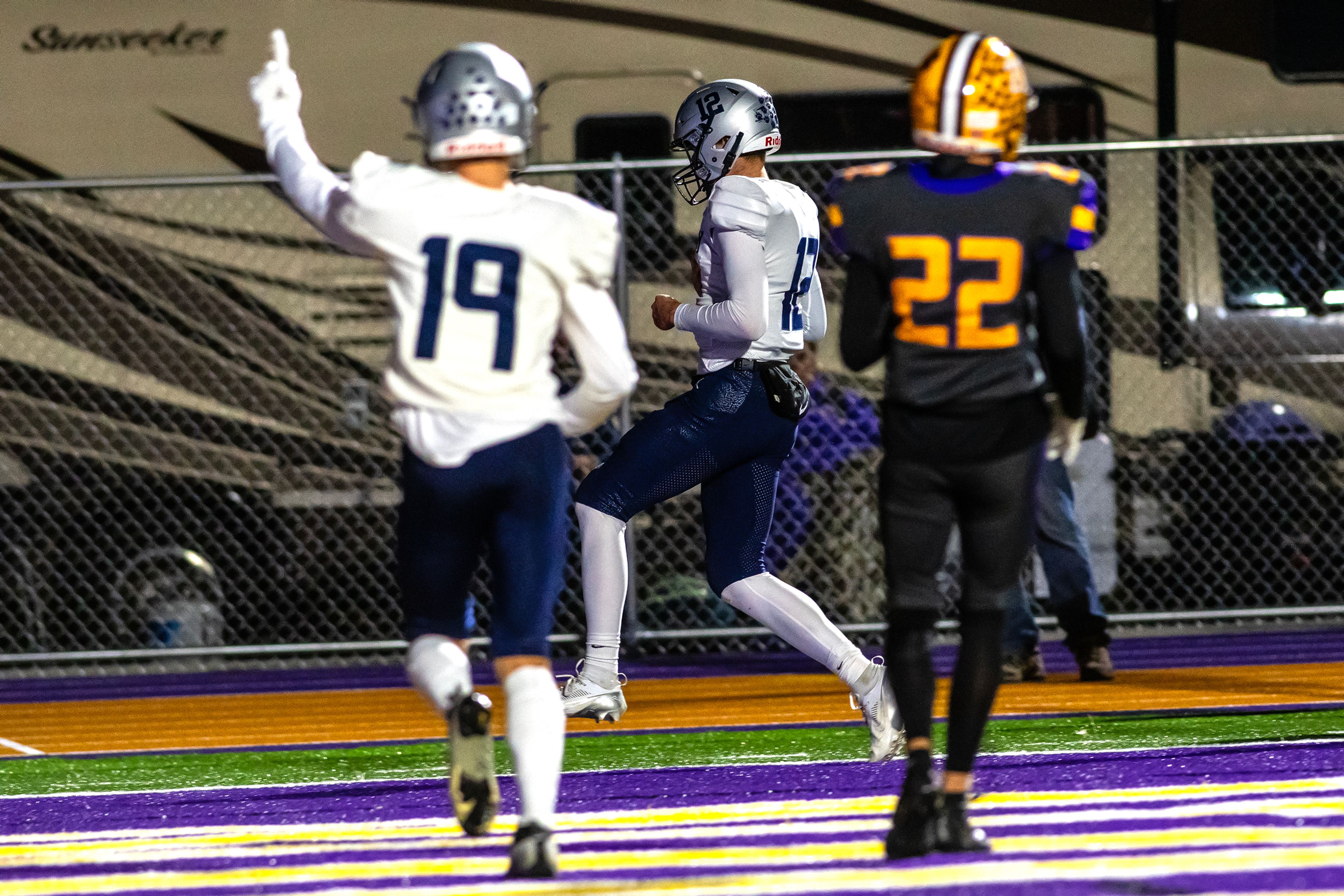 Lake City quarterback Avrey Cherry scores the first touchdown against Lewisotn in a nonconference game Friday at Lewiston High School.,