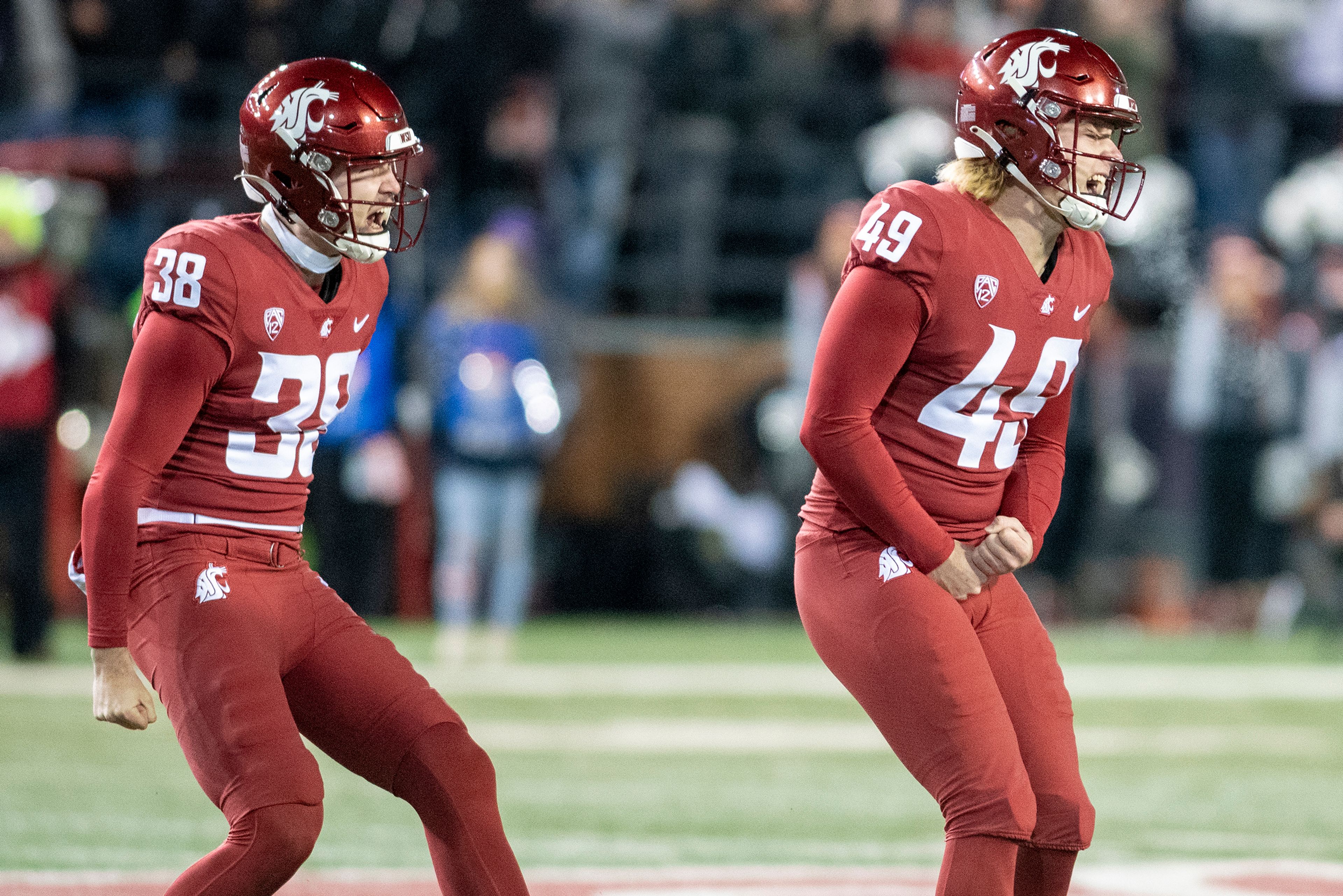 Washington State kicker Dean Janikowski, right, celebrates after making a 50-yard field goal during the first quarter of the Apple Cup on Nov. 26, 2022, at Gesa Field in Pullman.