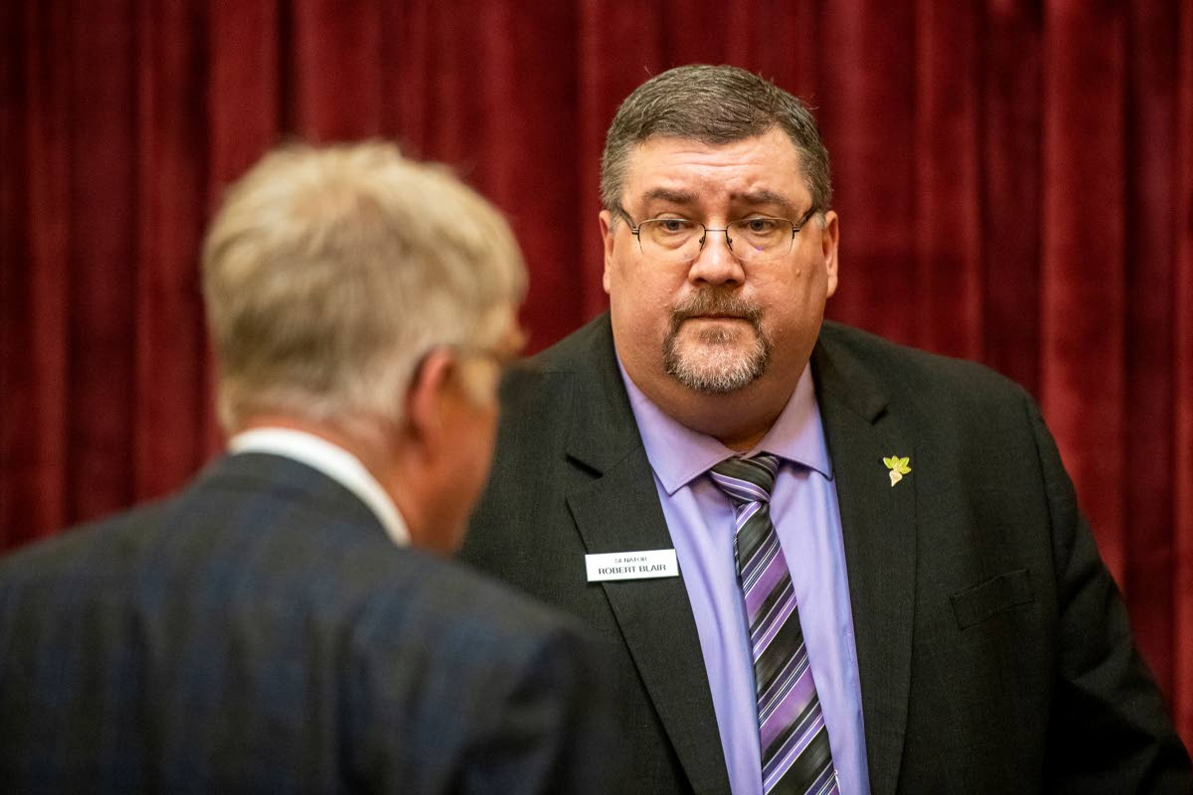 Sen. Robert Blair speaks with Sen. David Nelson following a legislative session at the Idaho State Capitol in Boise earlier this month. Blair and Nelson both live in Idaho 6th Legislative District in the state's redrawn map.