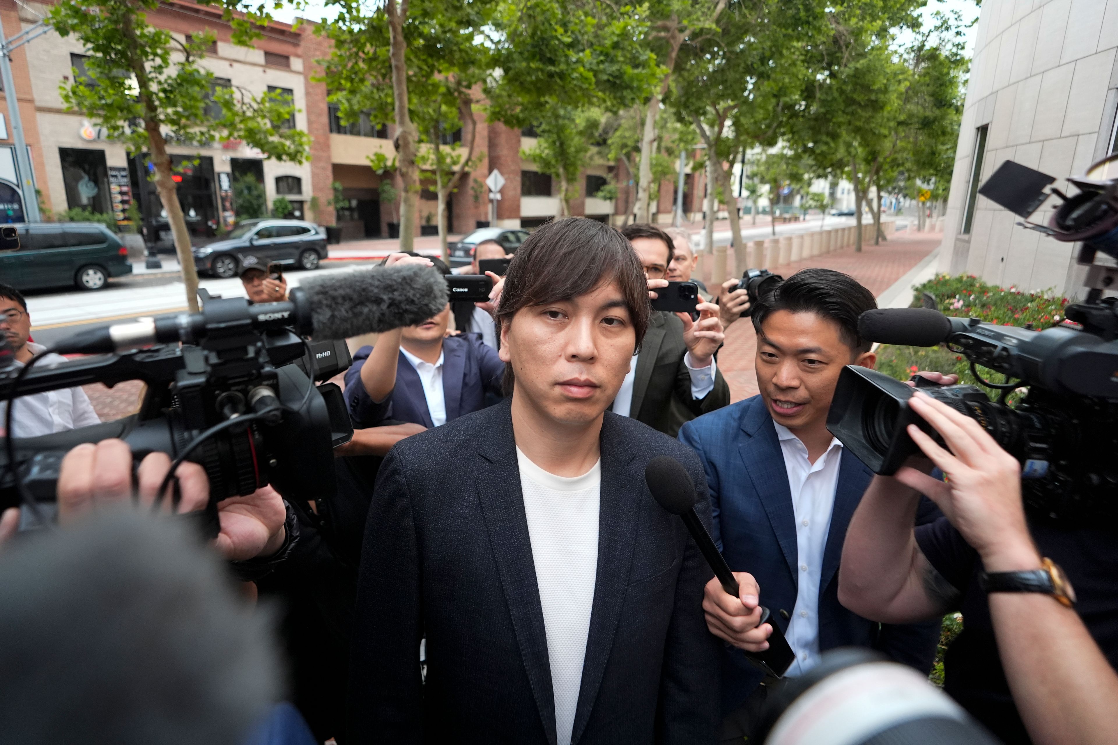 Ippei Mizuhara, the former interpreter for the Los Angeles Dodgers baseball star Shohei Ohtani, arrives at federal court in Los Angeles, Tuesday, June 4, 2024. Mizuhara is scheduled to plead guilty Tuesday to bank and tax fraud in a sports betting case where he is expected to admit to stealing nearly $17 million from the Japanese baseball player.