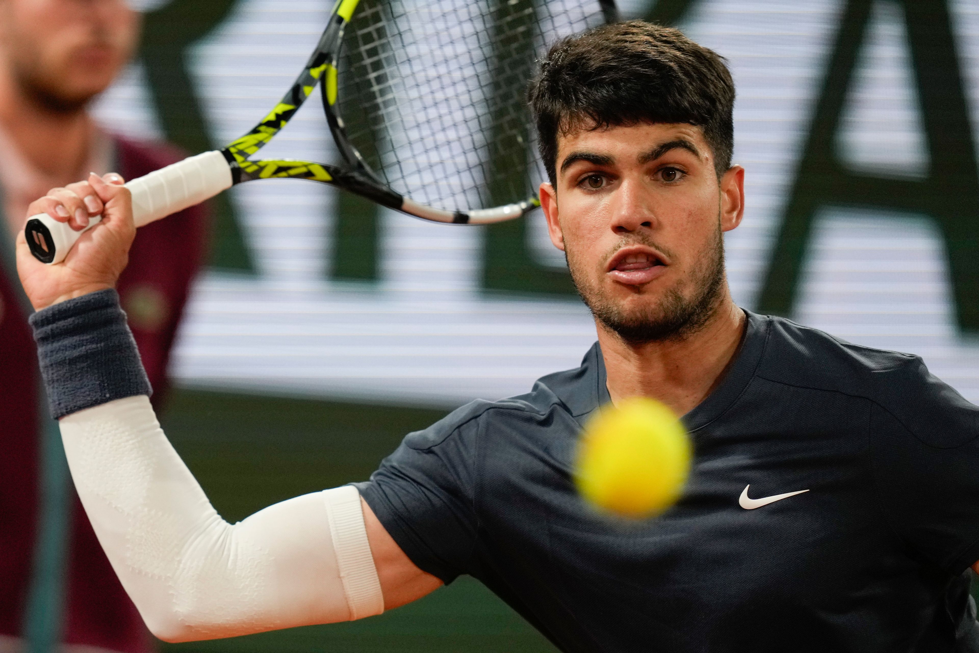 Spain's Carlos Alcaraz plays a shot against Sebastian Korda of the U.S. during their third round match of the French Open tennis tournament at the Roland Garros stadium in Paris, Friday, May 31, 2024.