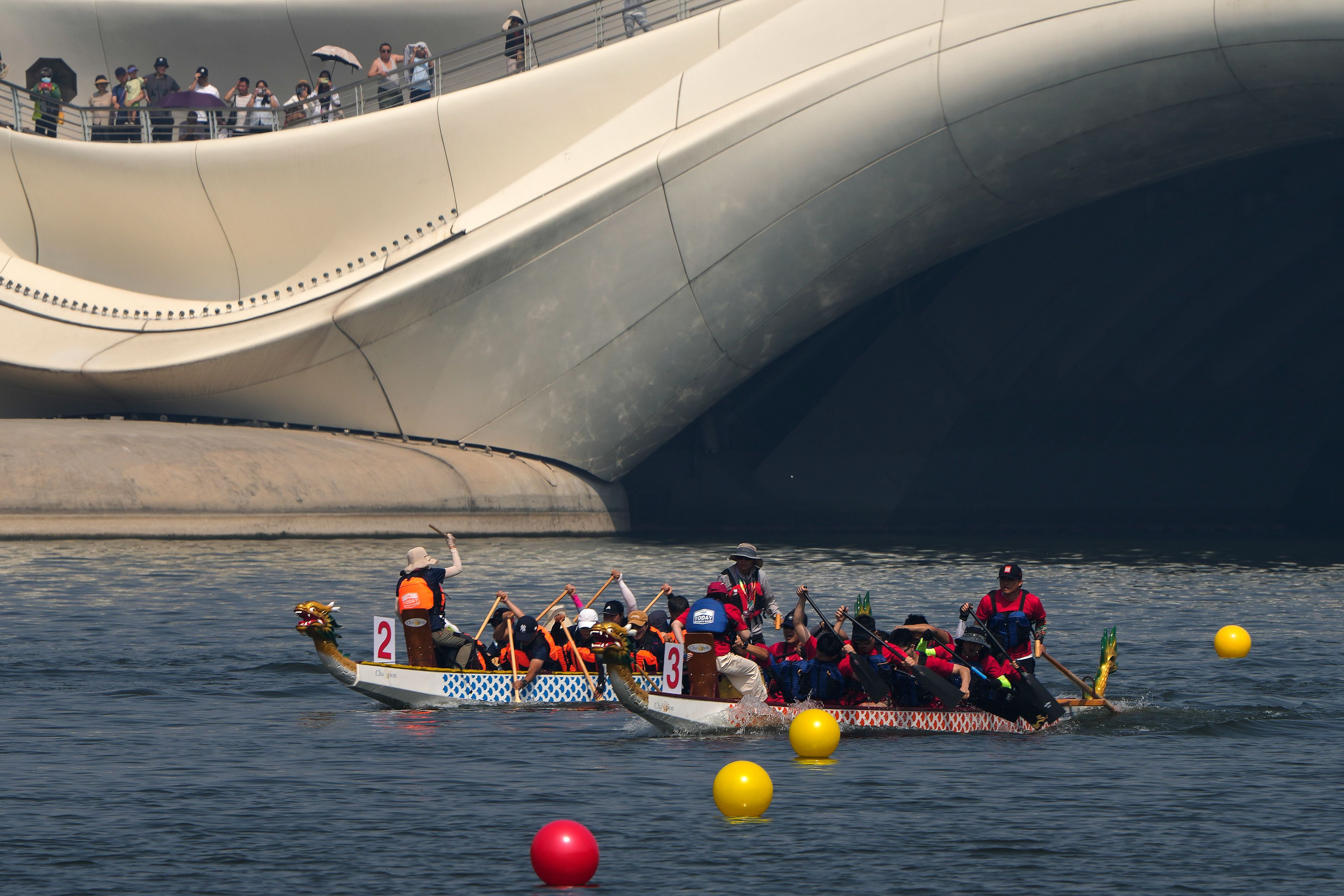 Teams of dragon boat racers paddle their boats as they compete in the Dragon Boat festival at a canal in Tongzhou, on the outskirts of Beijing, Monday, June 10, 2024. The Duanwu festival, also known as the Dragon Boat festival, falls on the fifth day of the fifth month of the Chinese lunar calendar and is marked by celebrations like eating rice dumplings and racing dragon boats.