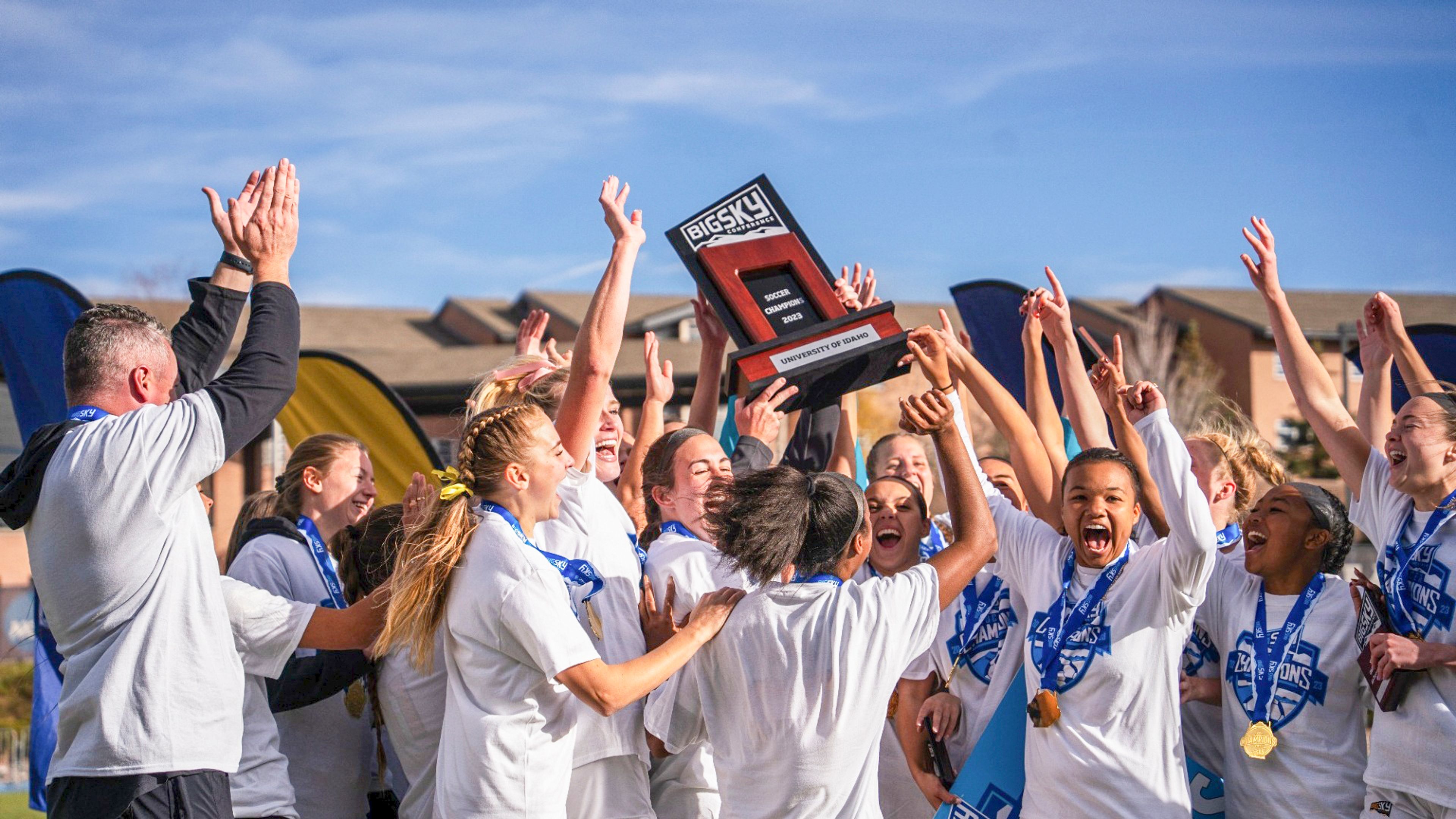 The Idaho soccer team hoists the Big Sky Conference championship trophy after defeating Northern Arizona on Sunday in Flagstaff, Ariz.